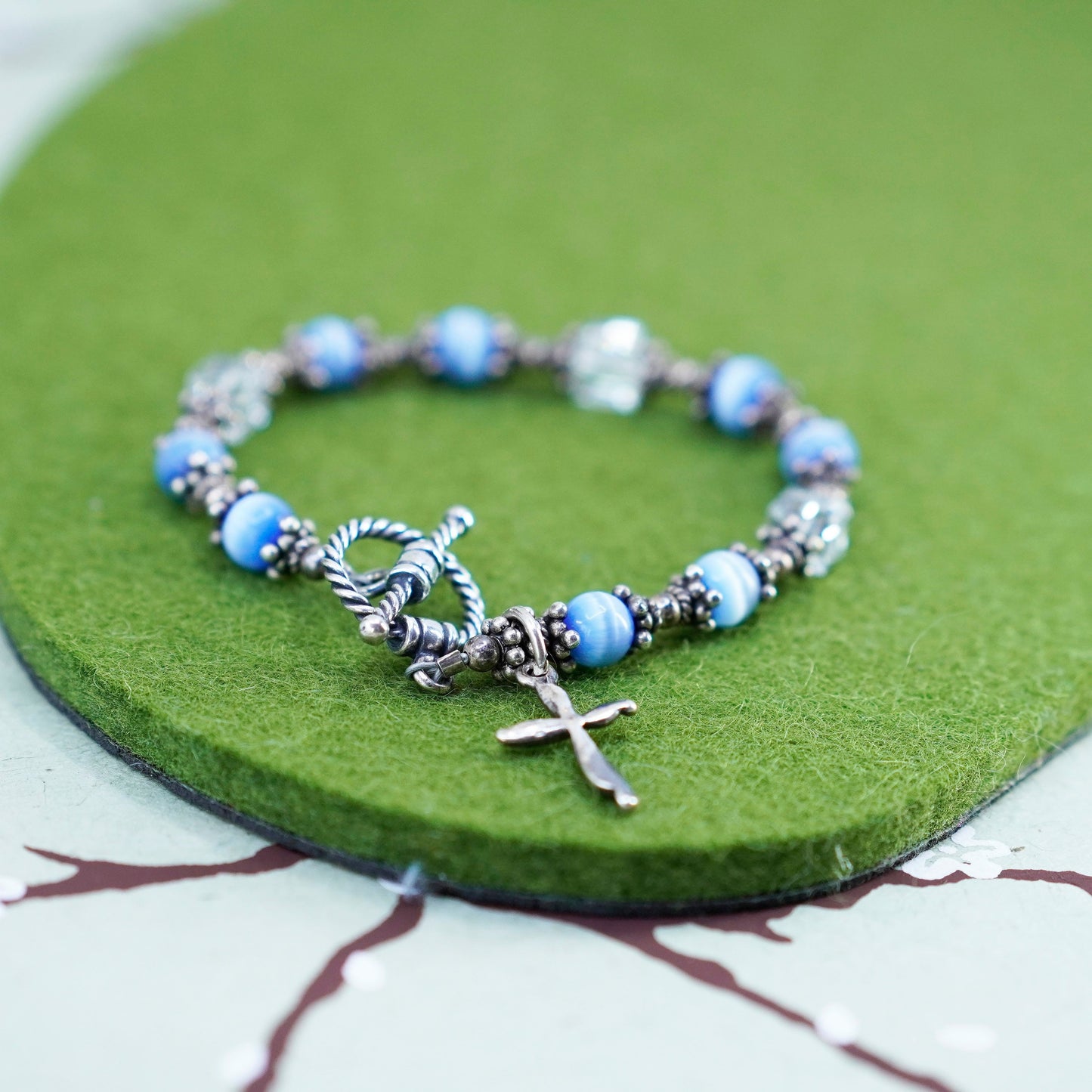 6”, Mexico 925 sterling silver bracelet with blue cats eye bead and cross charm