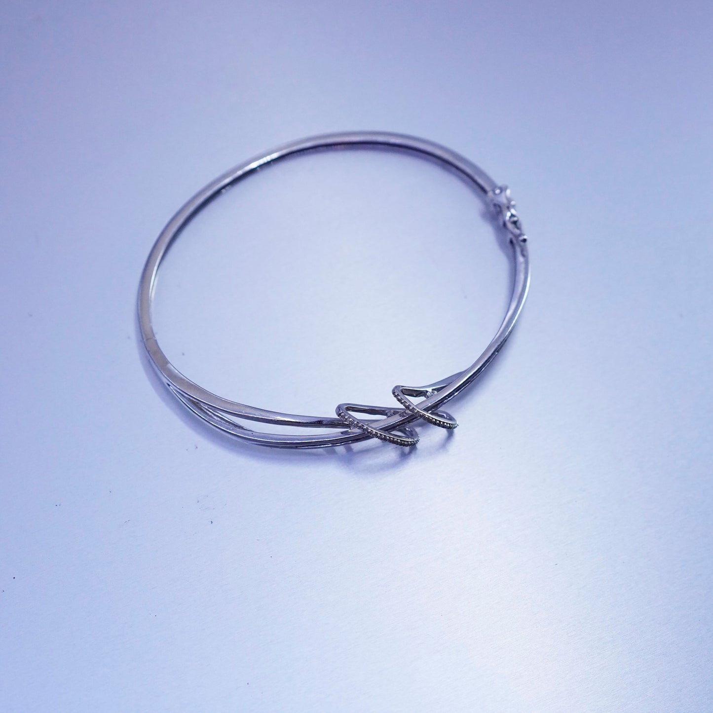 7”, Sterling 925 silver bracelet, entwined hinged bangle with cluster diamonds
