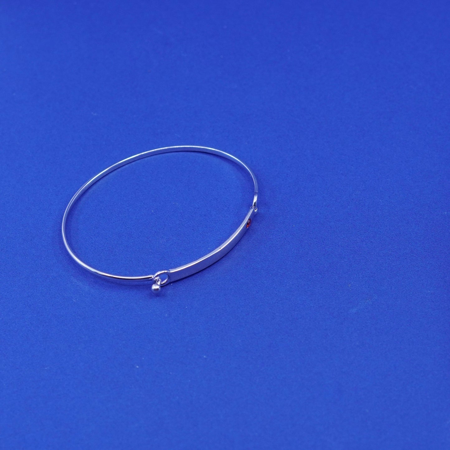 7.5”, Elle Sterling silver bracelet, 925 matted glitter hinged bangle with ruby