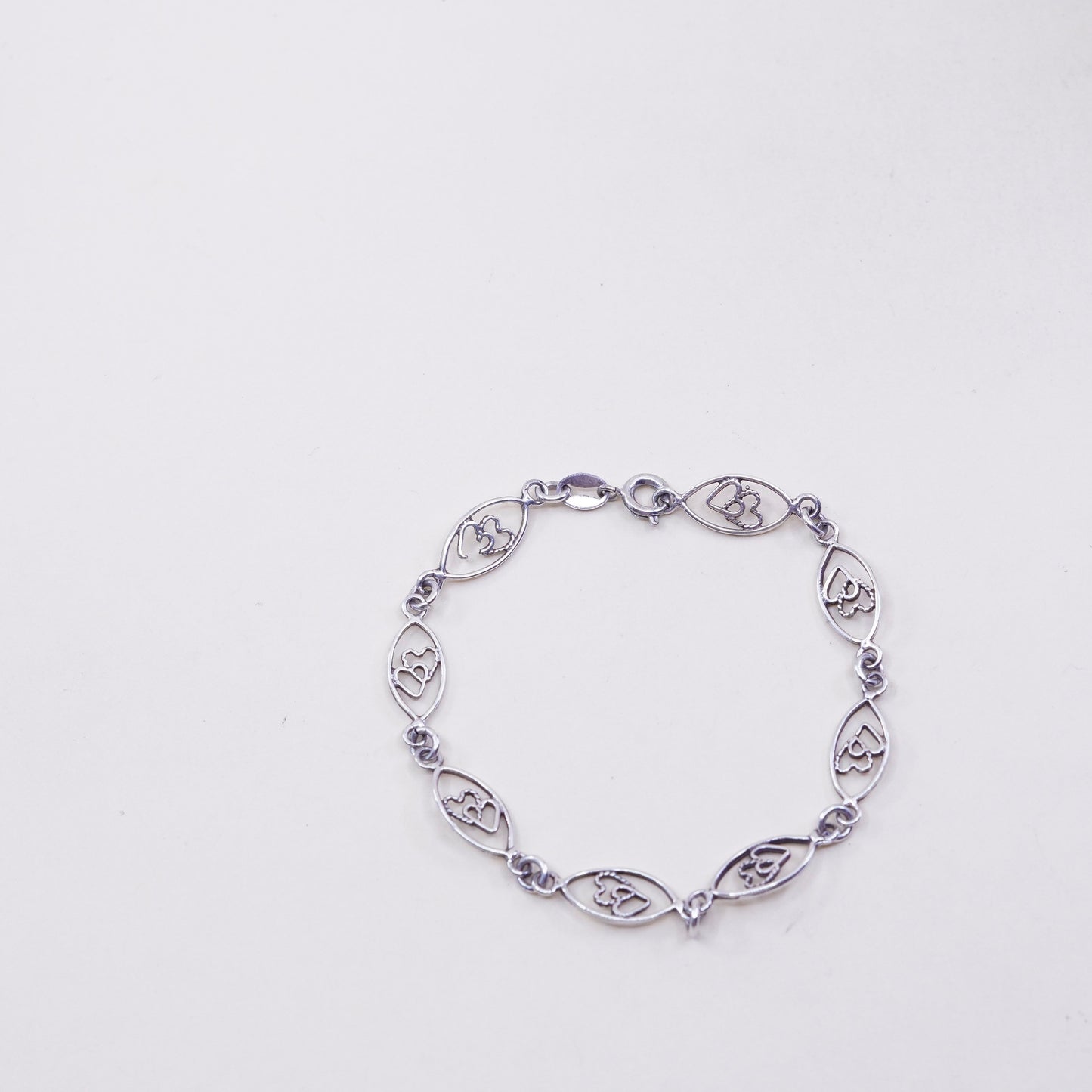 6.75”, sterling 925 silver Marquise shaped bracelet with double heart inside