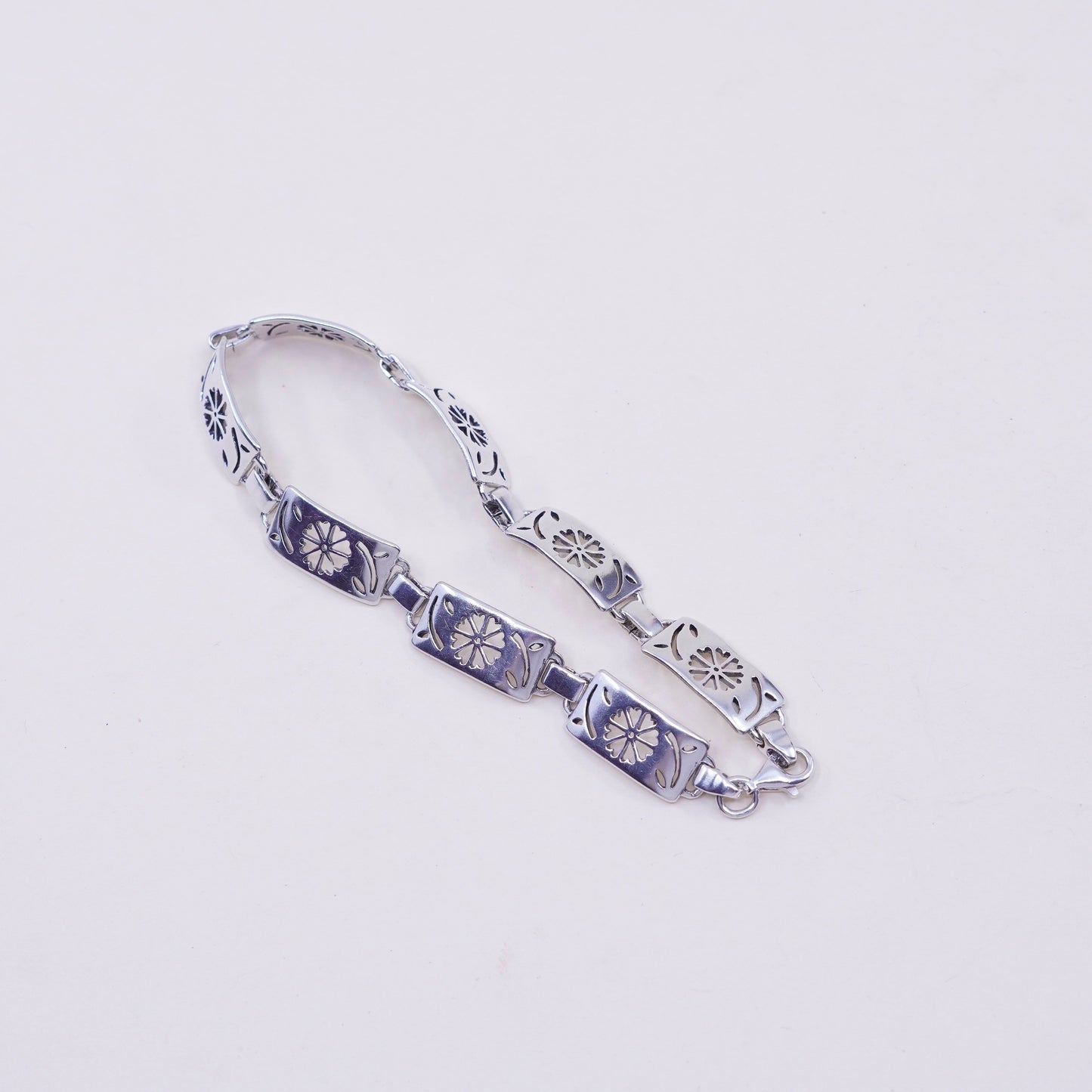 7.75”, sterling silver tennis bracelet, textured 925 chain with flower cut out
