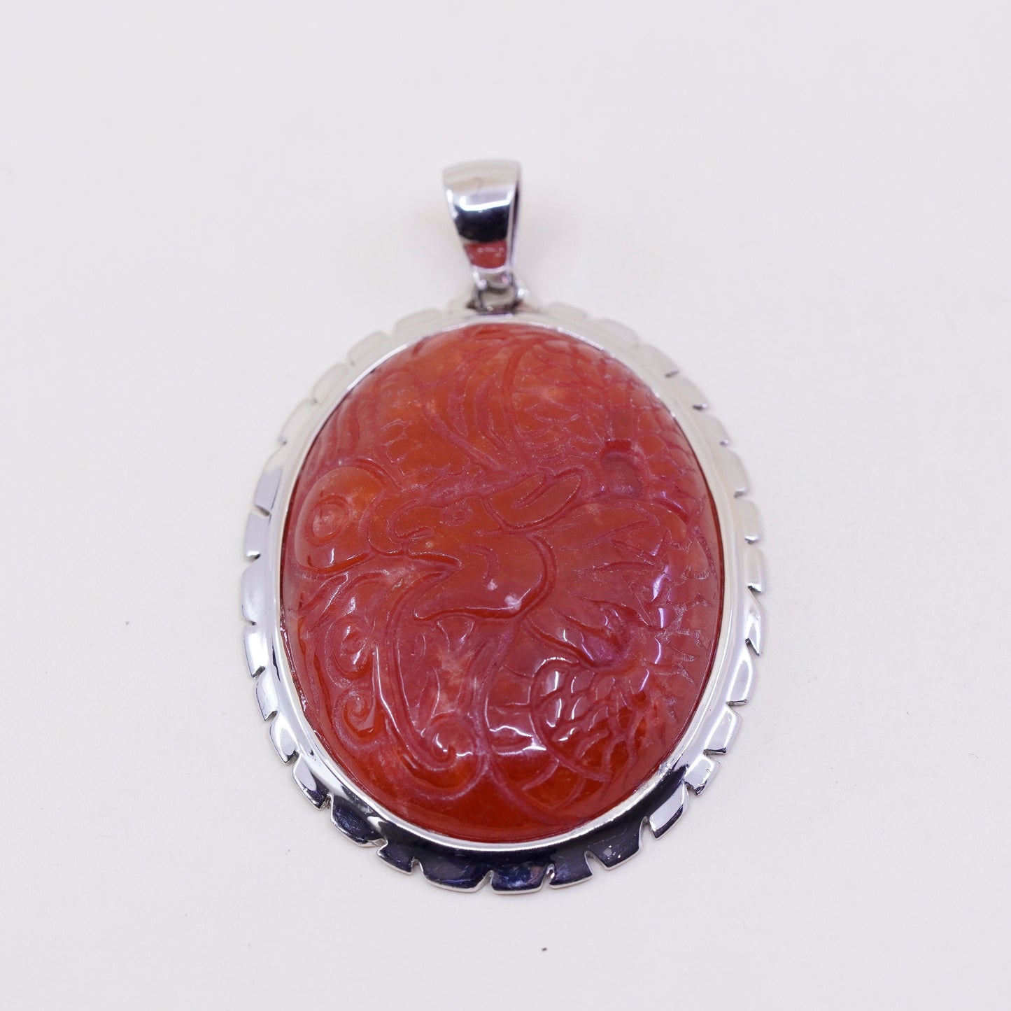 Vintage sterling 925 silver handmade pendant with carved carnelian