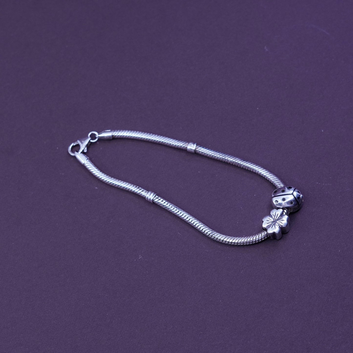 7.25”, Sterling silver snake chain, 925 bracelet w/ lady bug and flower charms