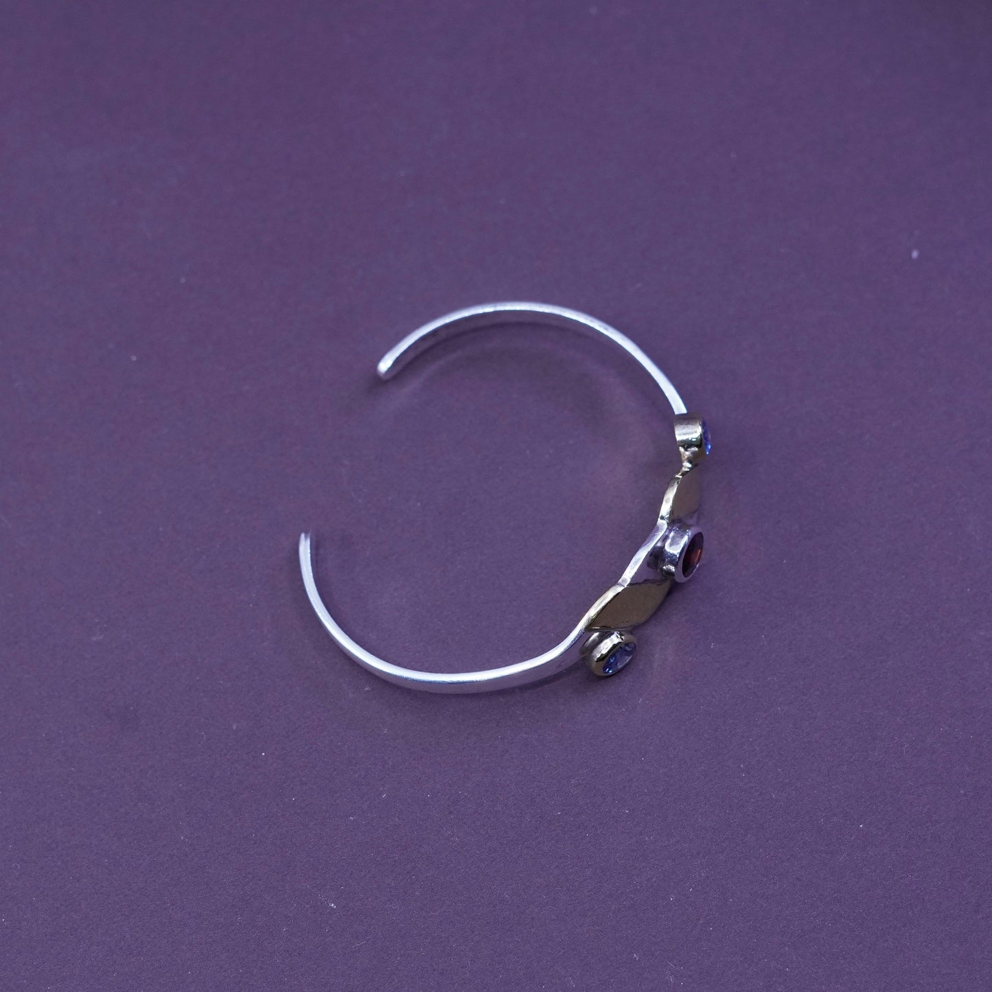 6”, two tone sterling silver bracelet, 925 wavy cuff with brass and ruby topaz