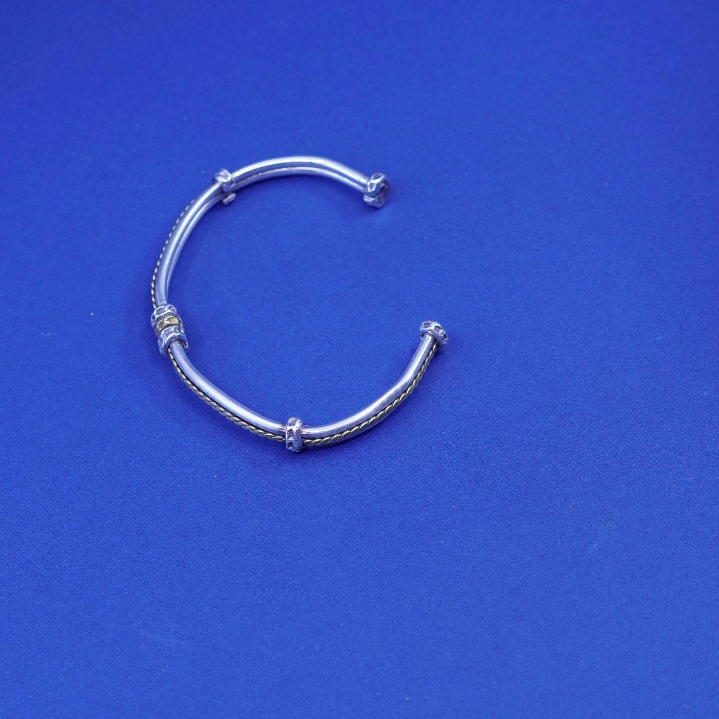 7.25”, two tone Sterling silver bracelet, ribbed 925 cuff with brass cable