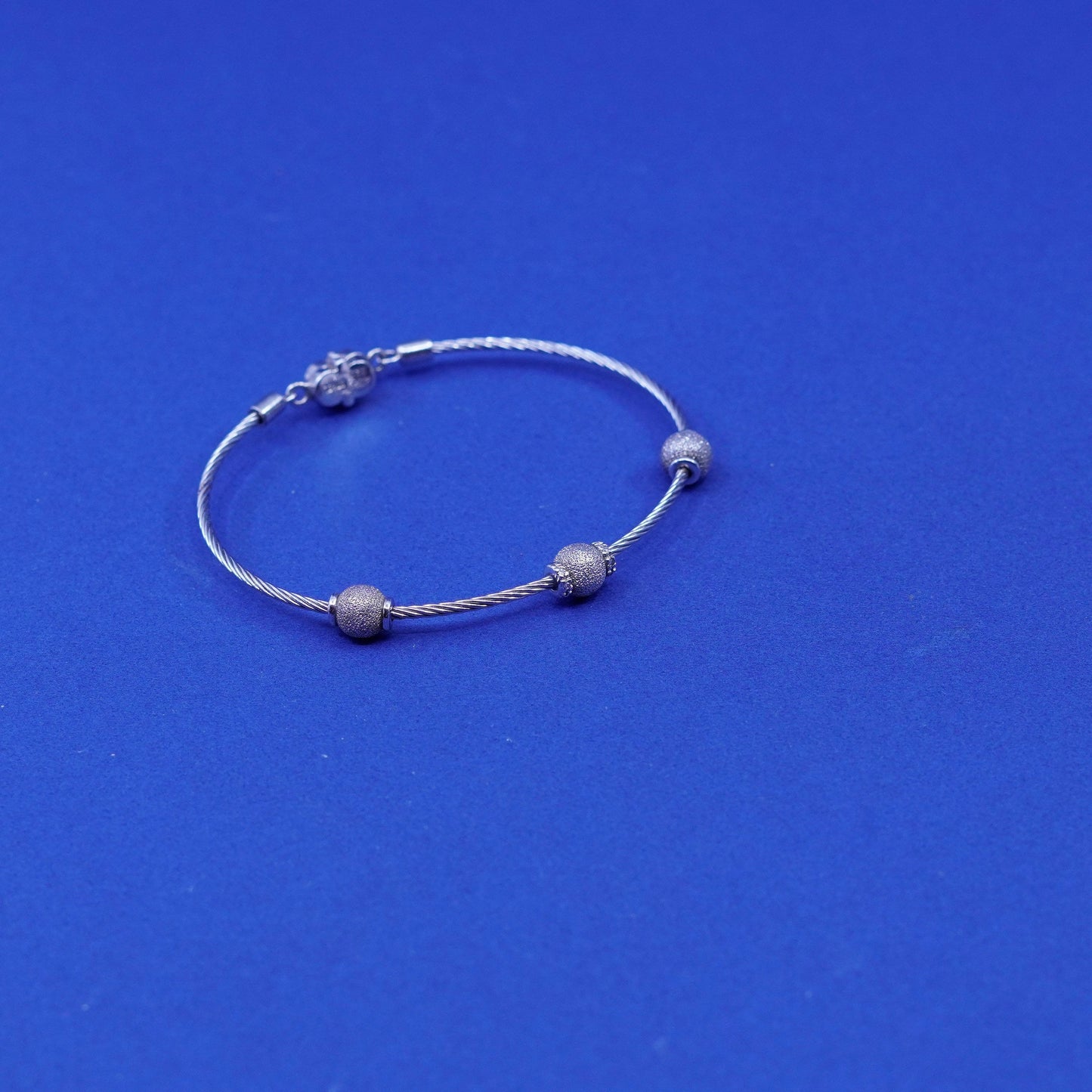 7”, stainless steel cable bracelet with Sterling 925 silver glittering beads