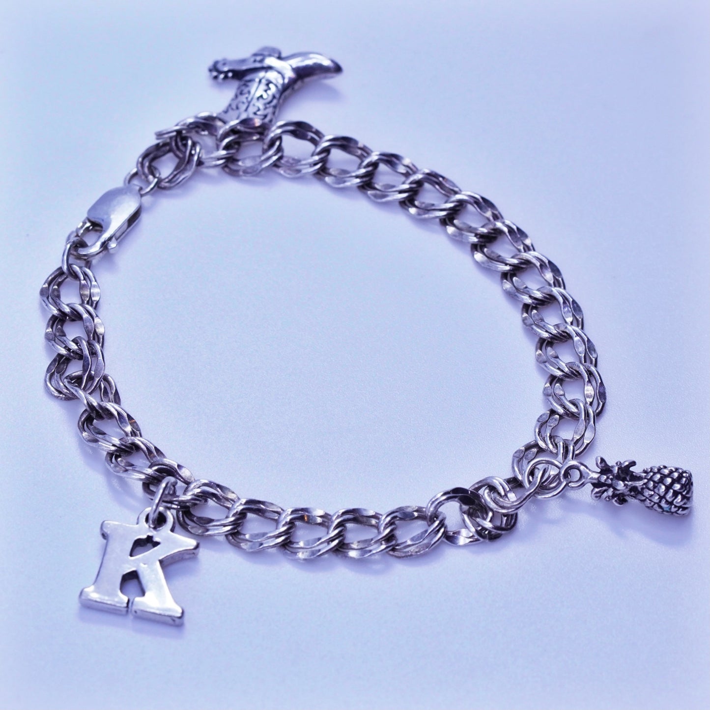 7.5”, Sterling 925 silver bracelet, curb chain K pineapple riding boot charms