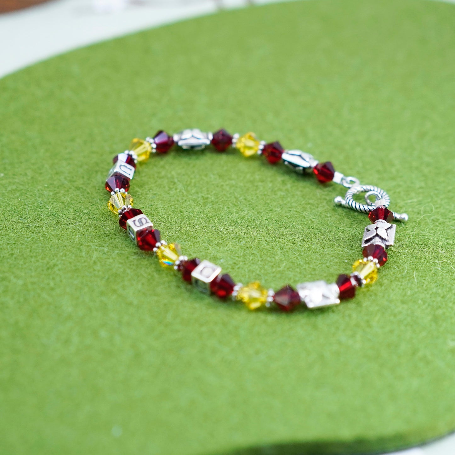 7”, vintage 925 sterling silver bracelet with red yellow crystal and USC cubes