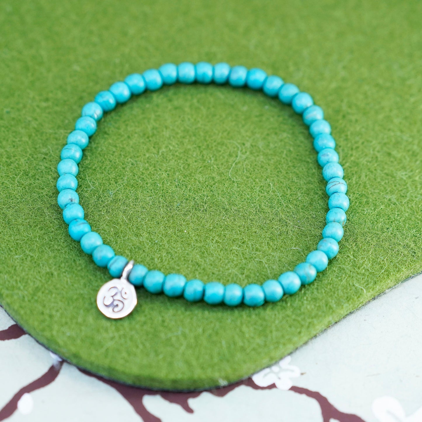 6.75”, handmade bracelet turquoise beads elastic band sterling 925 silver charm