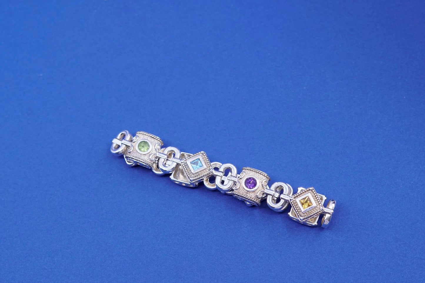 7”, Sterling 925 silver tennis bracelet w/ amethyst, peridot ruby citrine topaz