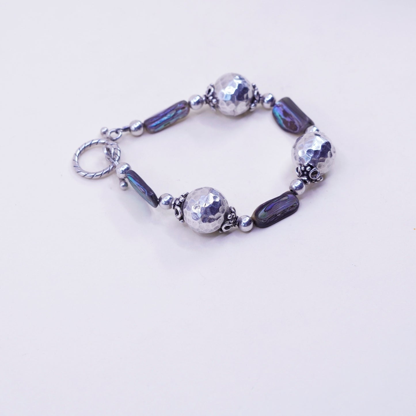 6.25”, vintage Sterling 925 silver bracelet, with hammered abalone beads