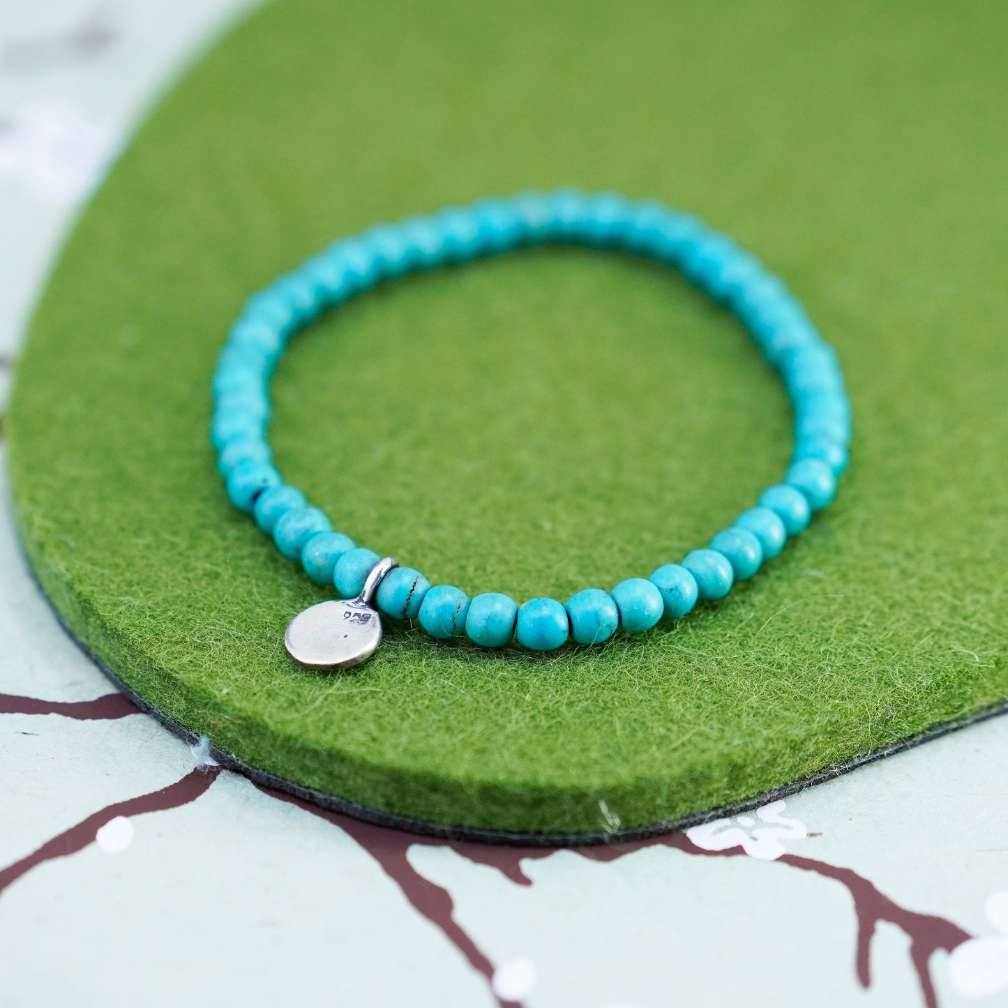 6.75”, handmade bracelet turquoise beads elastic band sterling 925 silver charm
