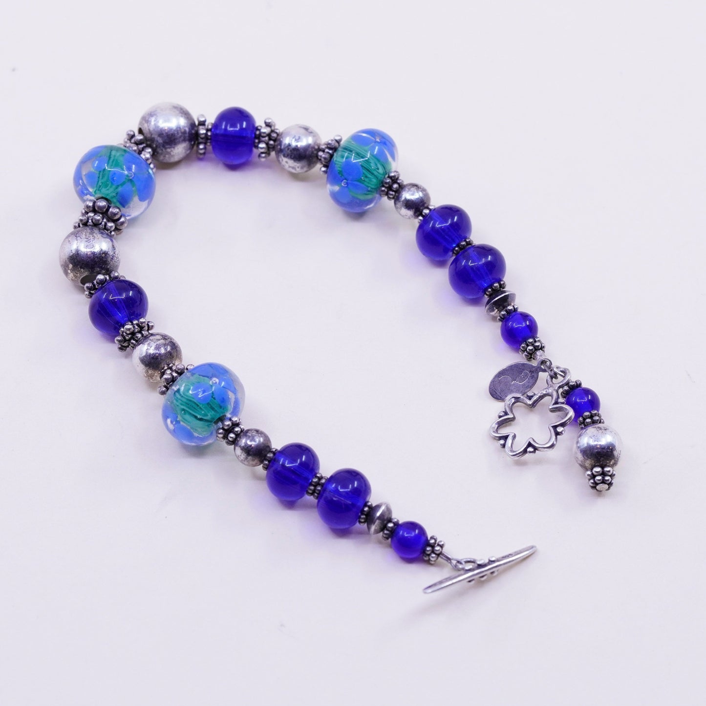 7.75”, vintage 925 Sterling silver bracelet with artisan blue glass beads