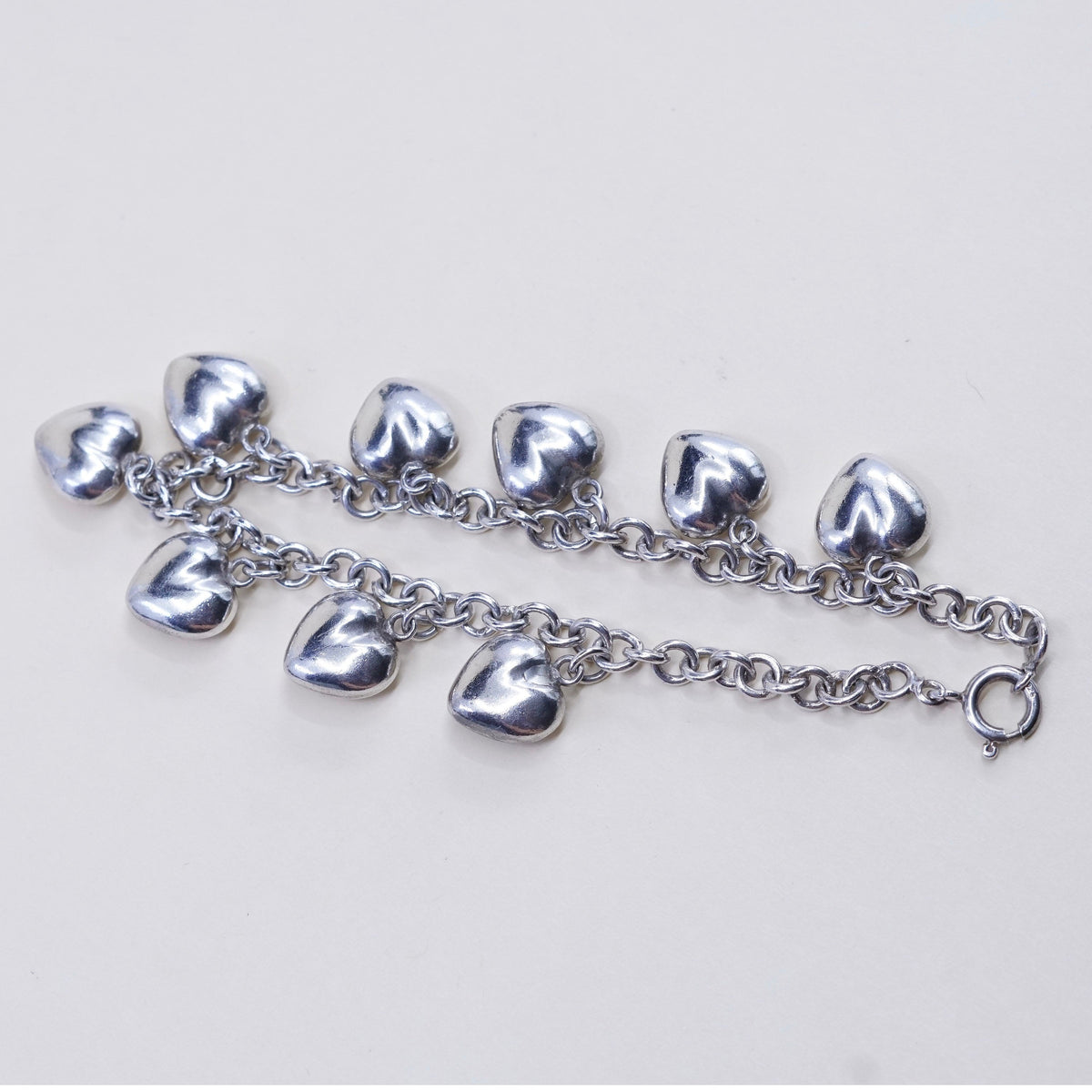 7.75”, 3mm, vtg JCM sterling 925 silver circle bracelet w/ cluster heart charms