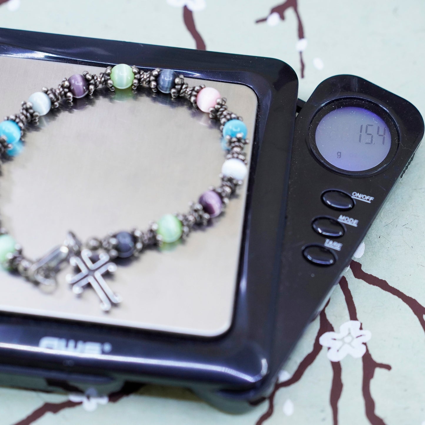 6.75”, sterling silver bracelet, 925 beads with colorful cats eye cross charm