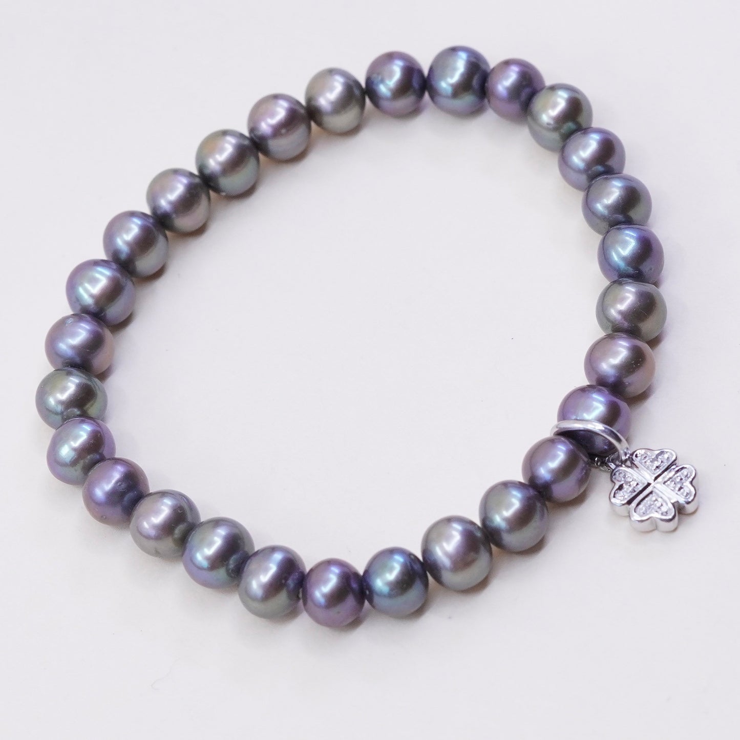 7”, bracelet, black pearl with elastic band and 925 silver lucky clover charm,