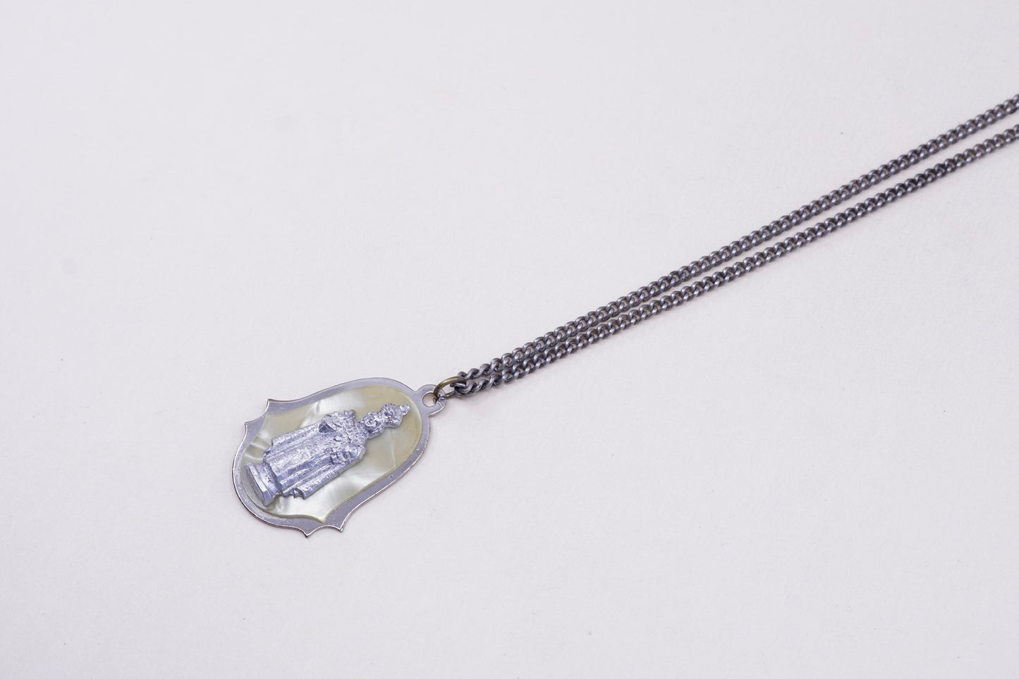 24”, vintage silver tone necklace with “queen” pendant