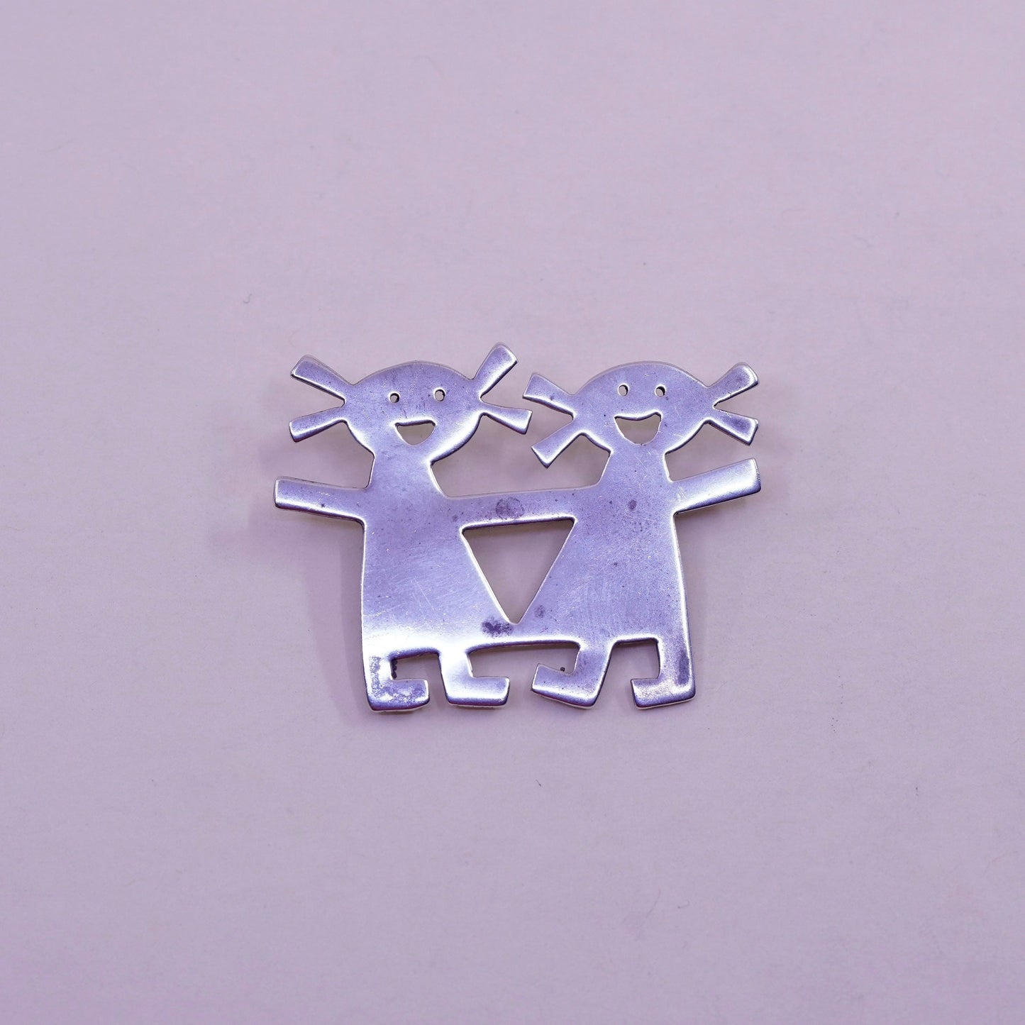 Vintage sterling 925 silver handmade brooch, two girls holding hands