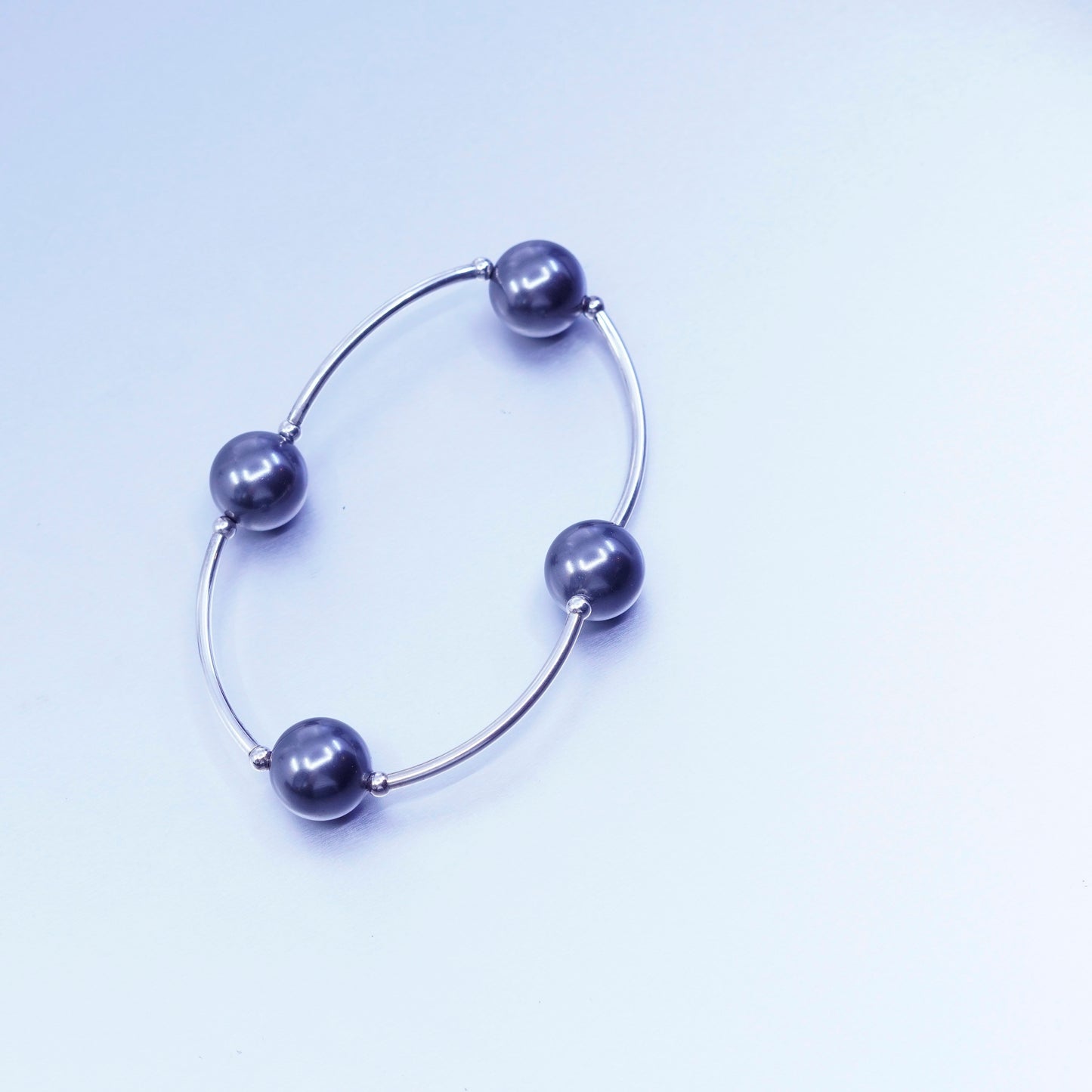 6.25”, Sterling 925 silver curvy bar bracelet with black pearl and elastic band