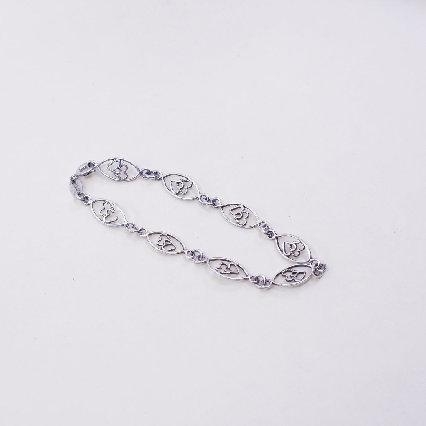 6.75”, sterling 925 silver Marquise shaped bracelet with double heart inside