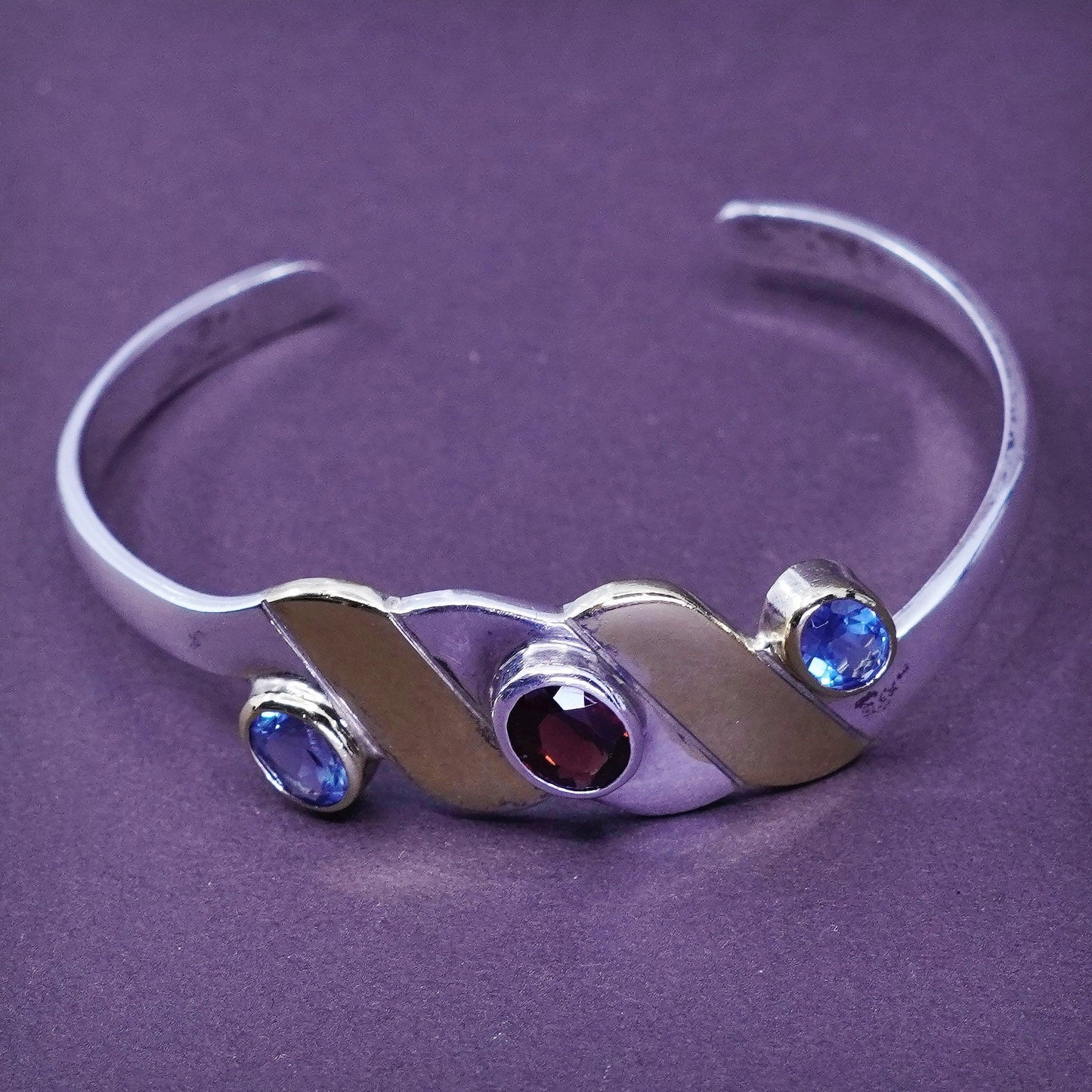 6”, two tone sterling silver bracelet, 925 wavy cuff with brass and ruby topaz