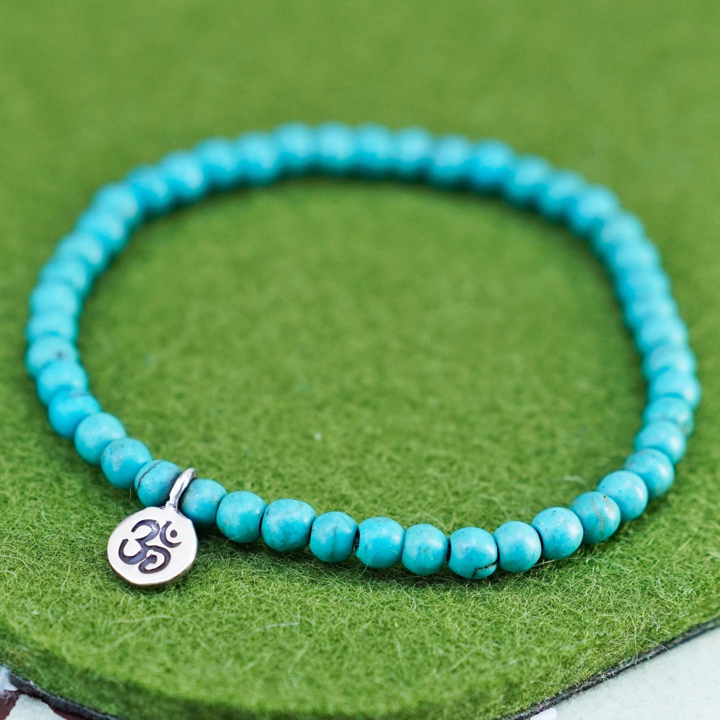 6.75”, handmade bracelet turquoise beads elastic band sterling 925 silver charm