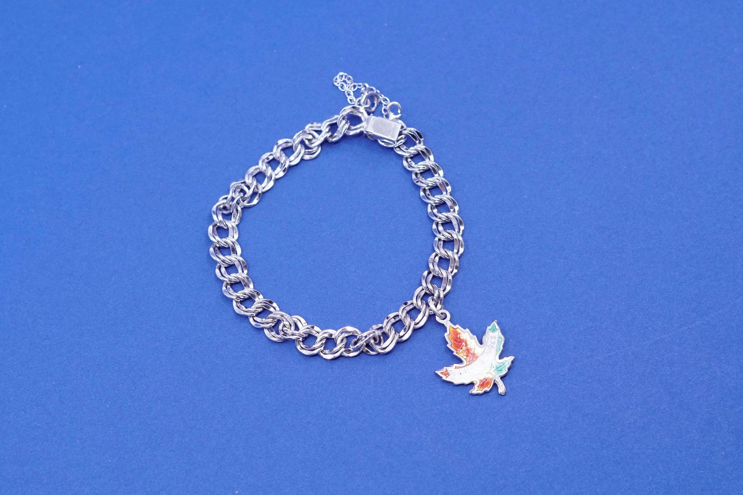 6.25”, Sterling silver bracelet, 925 double curb chain w/ Canada maple charm