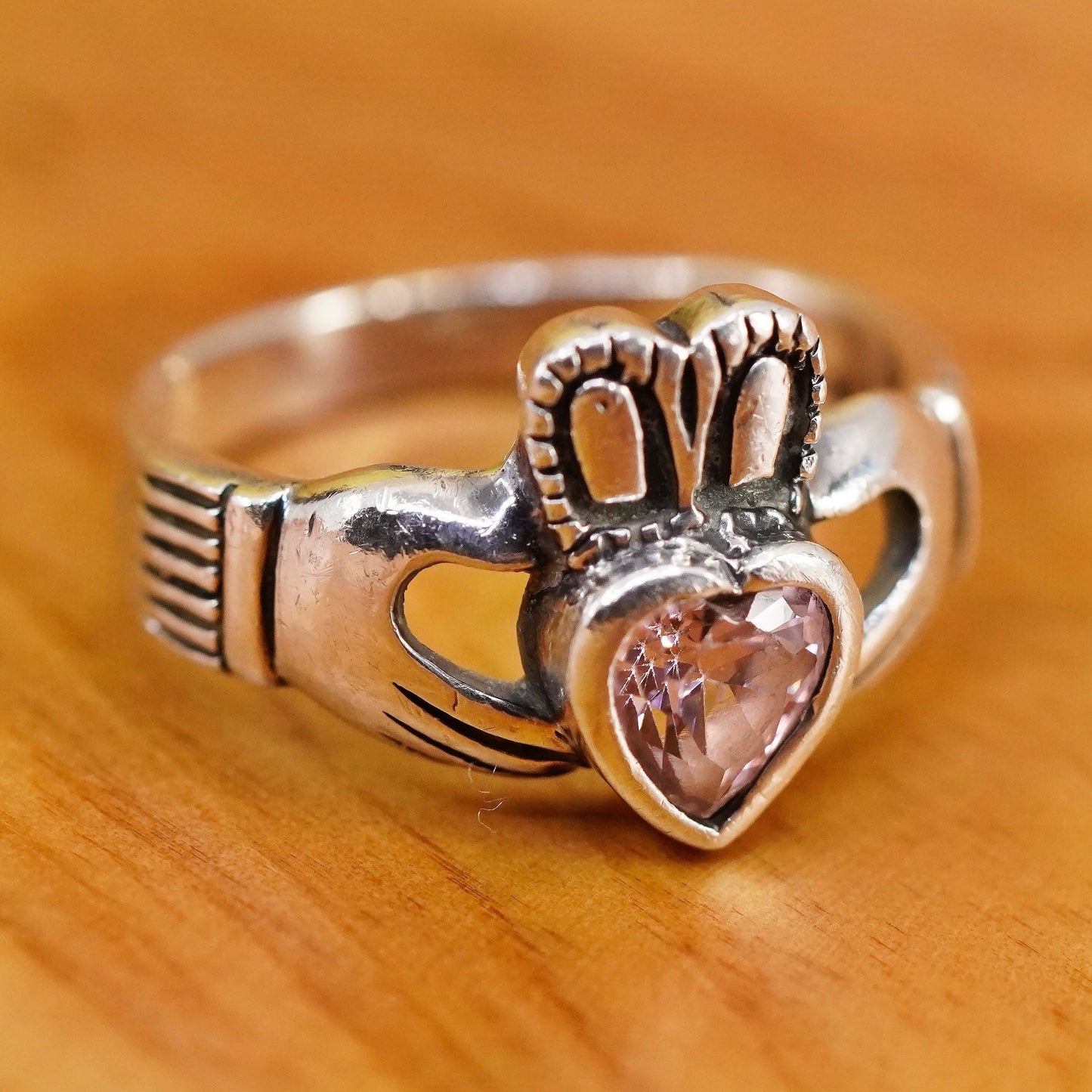 Size 7, Vintage sterling 925 silver claddagh ring, holding pink Cz heart band