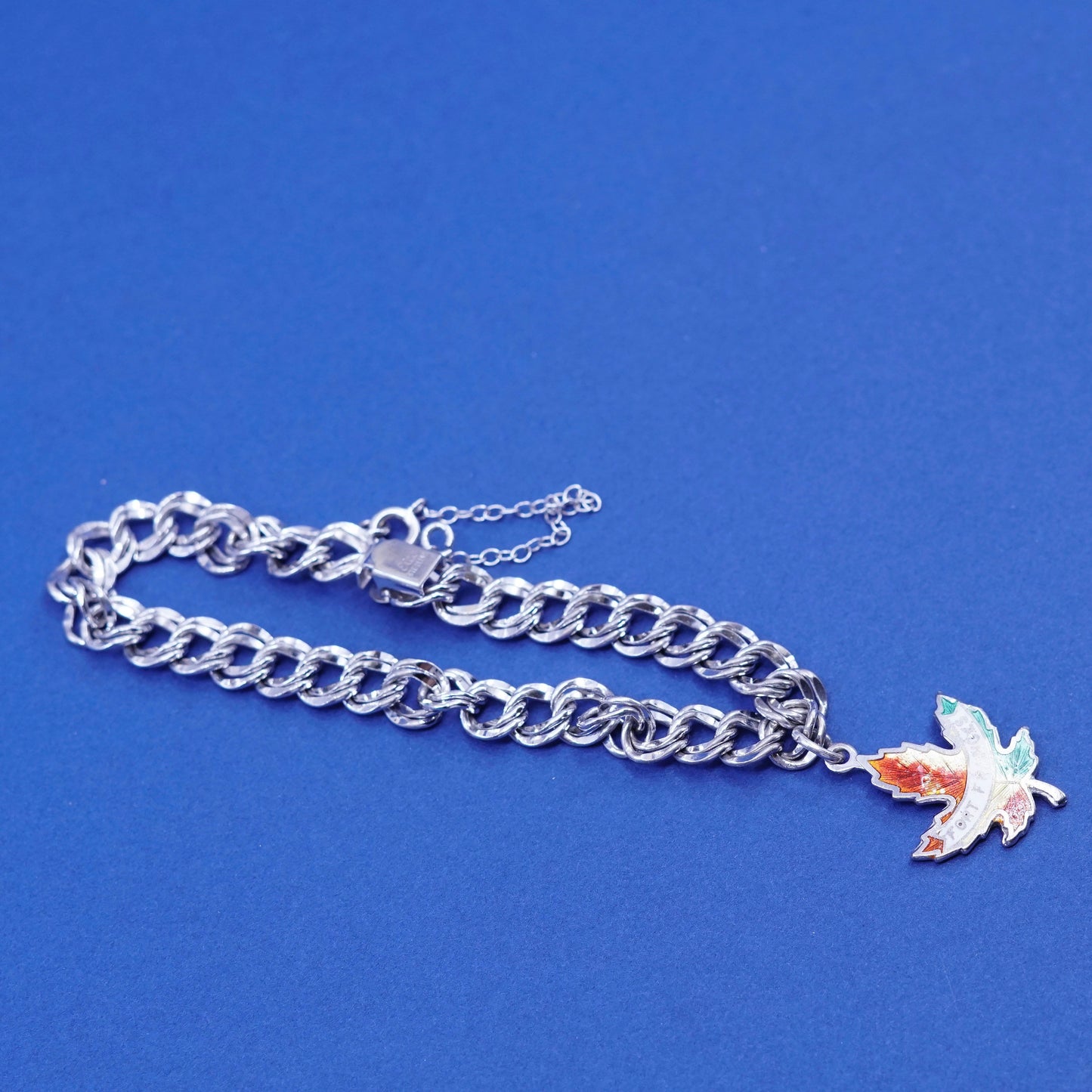 6.25”, Sterling silver bracelet, 925 double curb chain w/ Canada maple charm