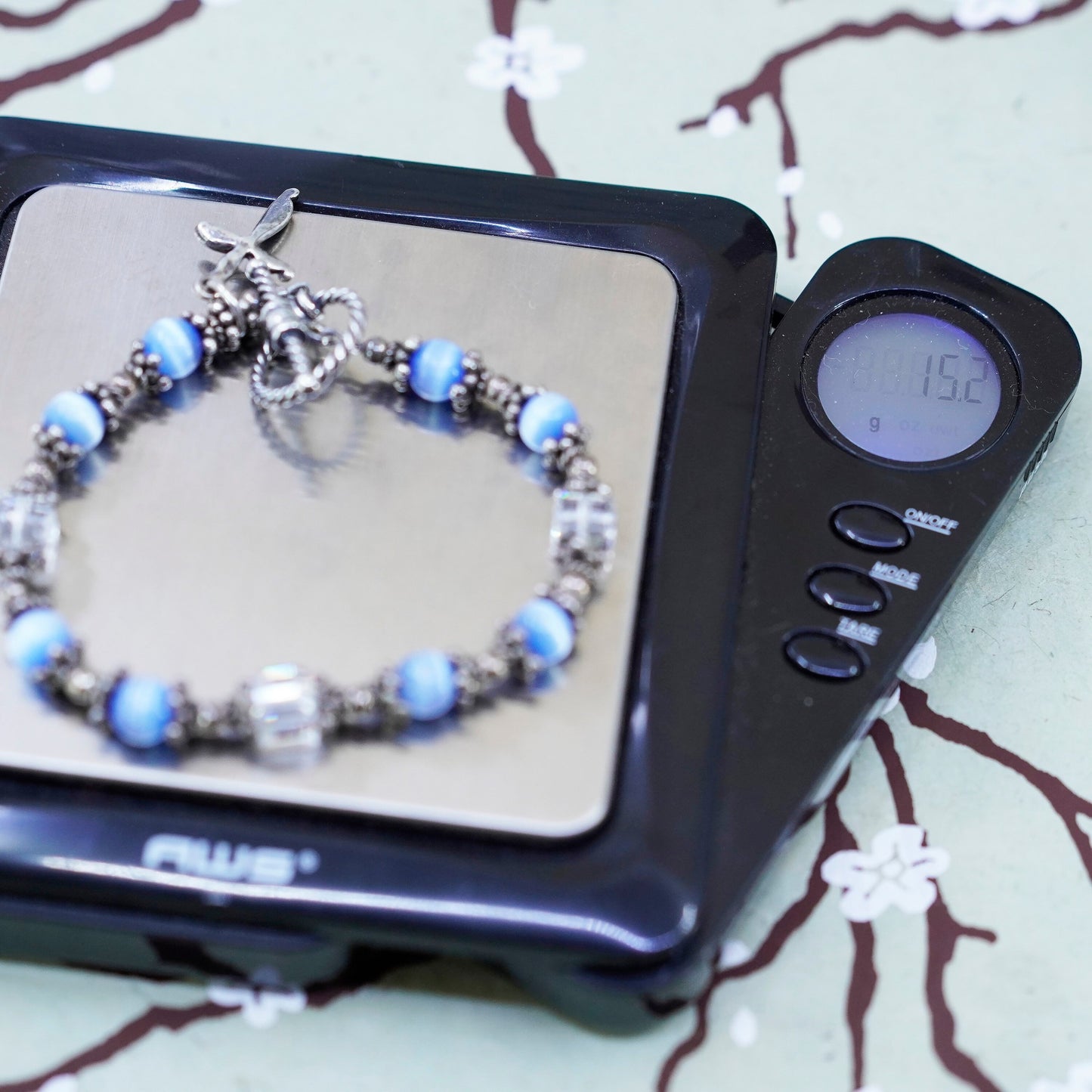 6”, Mexico 925 sterling silver bracelet with blue cats eye bead and cross charm
