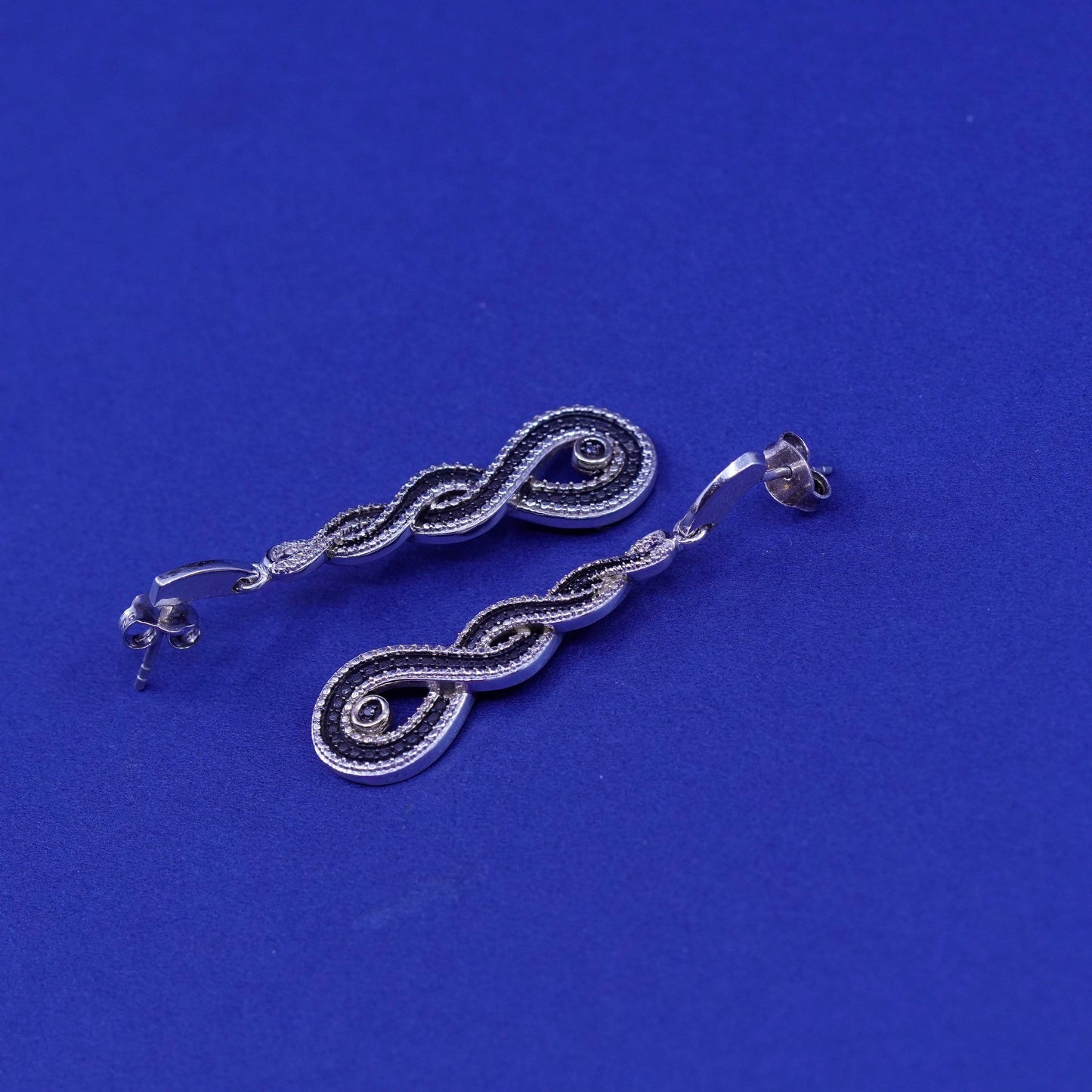 Two Tone Sterling 925 silver entwined earrings with 14K gold accent diamond