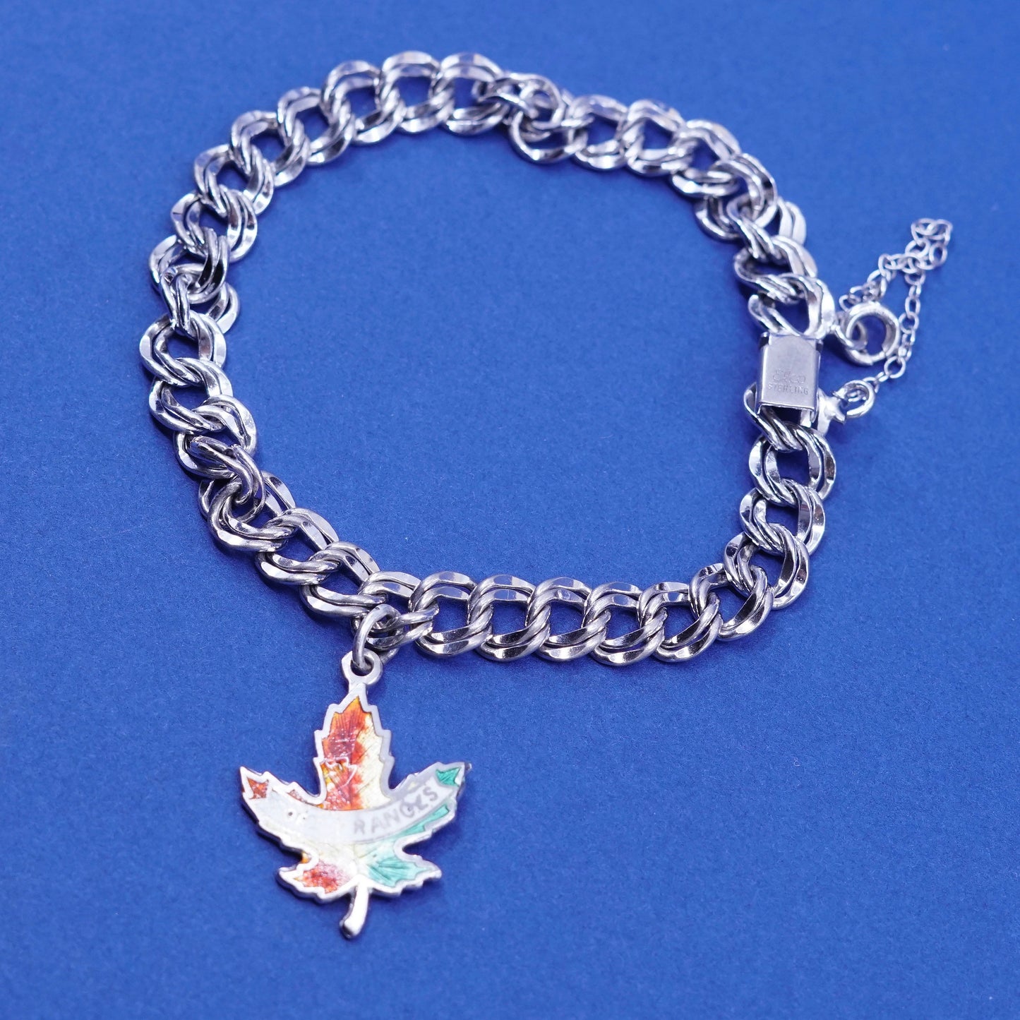 6.25”, Sterling silver bracelet, 925 double curb chain w/ Canada maple charm
