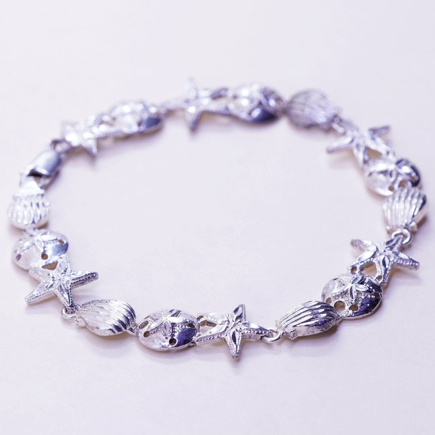 7.75”, ocean lover Sterling silver bracelet, 925 sand dollar, shell, starfish