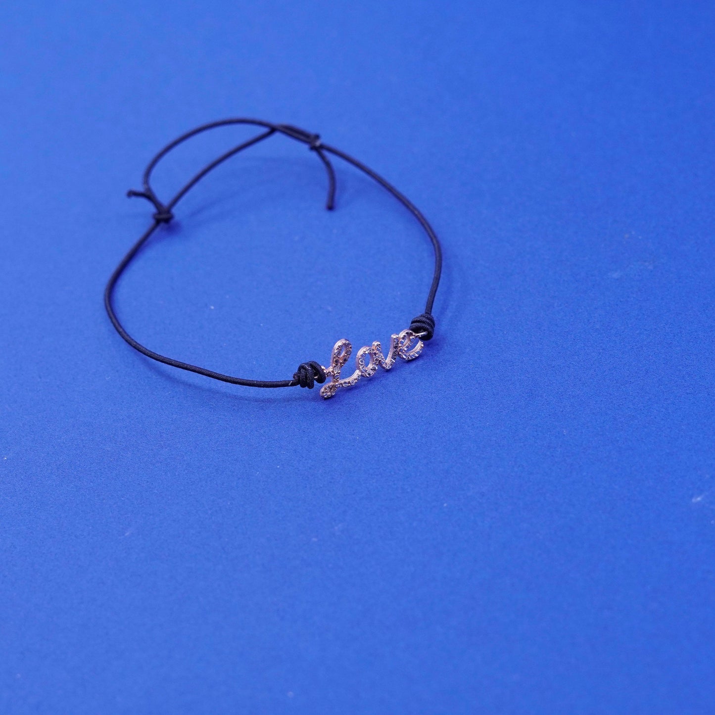 7.5”, vermeil gold over Sterling silver bracelet, elastic band “love” charm