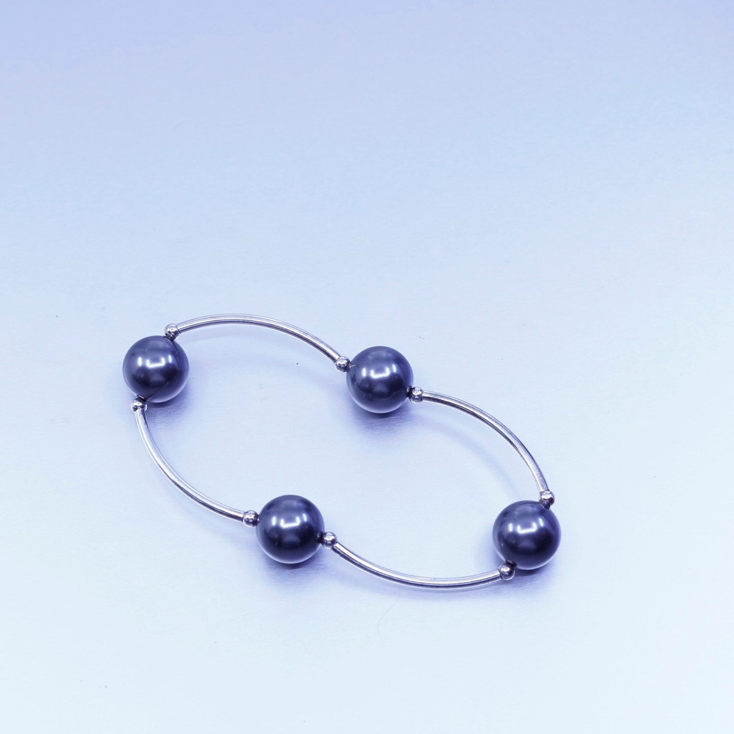 6.25”, Sterling 925 silver curvy bar bracelet with black pearl and elastic band
