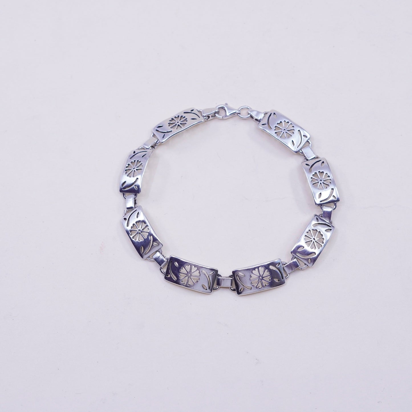 7.75”, sterling silver tennis bracelet, textured 925 chain with flower cut out