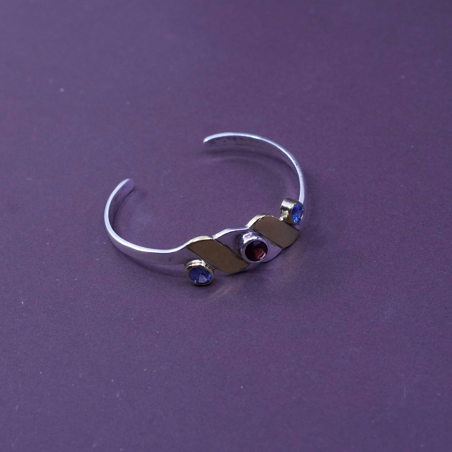 6”, two tone sterling silver bracelet, 925 wavy cuff with brass and ruby topaz