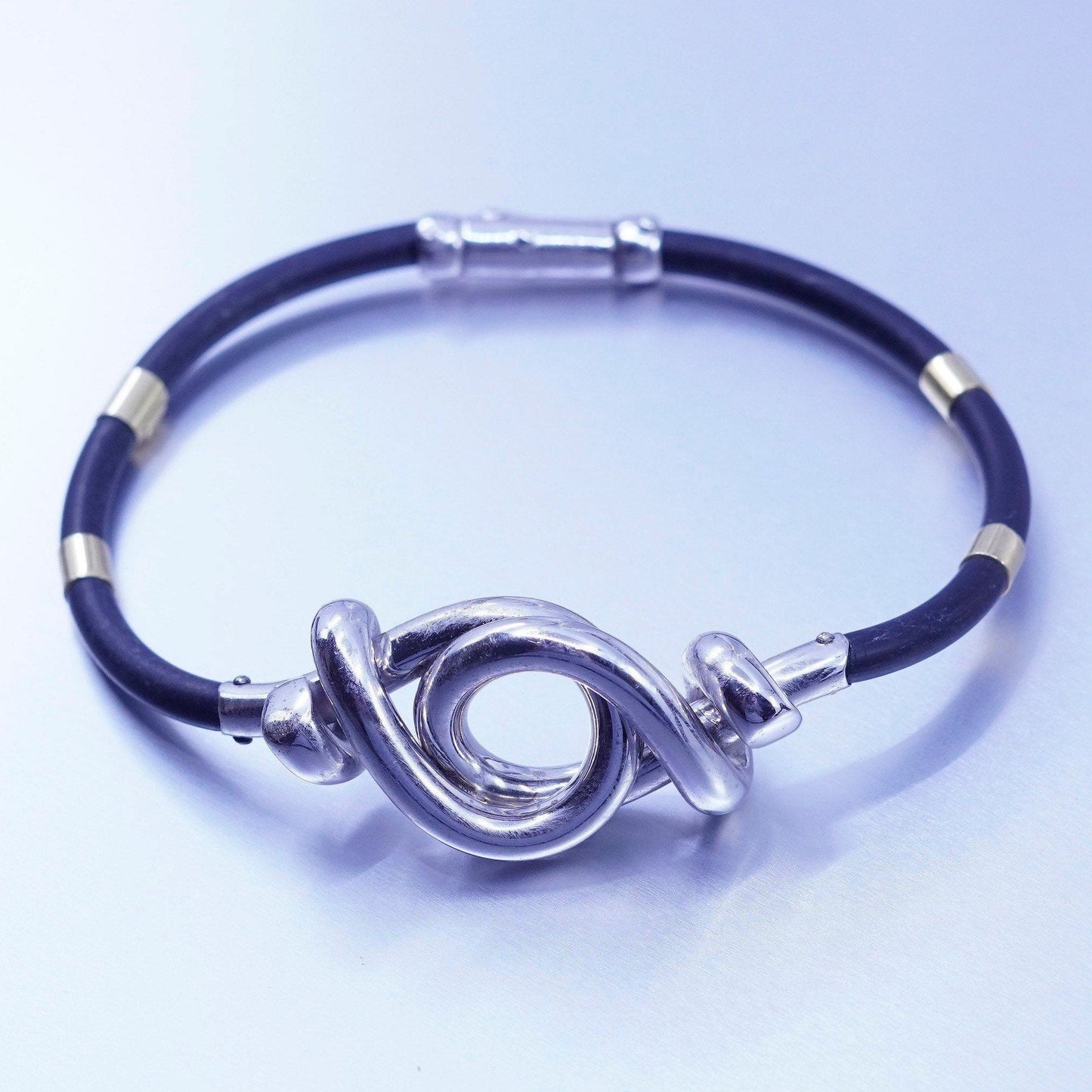 6.75”, sterling 925 silver knot bracelet with 14K gold tube black rubber chain