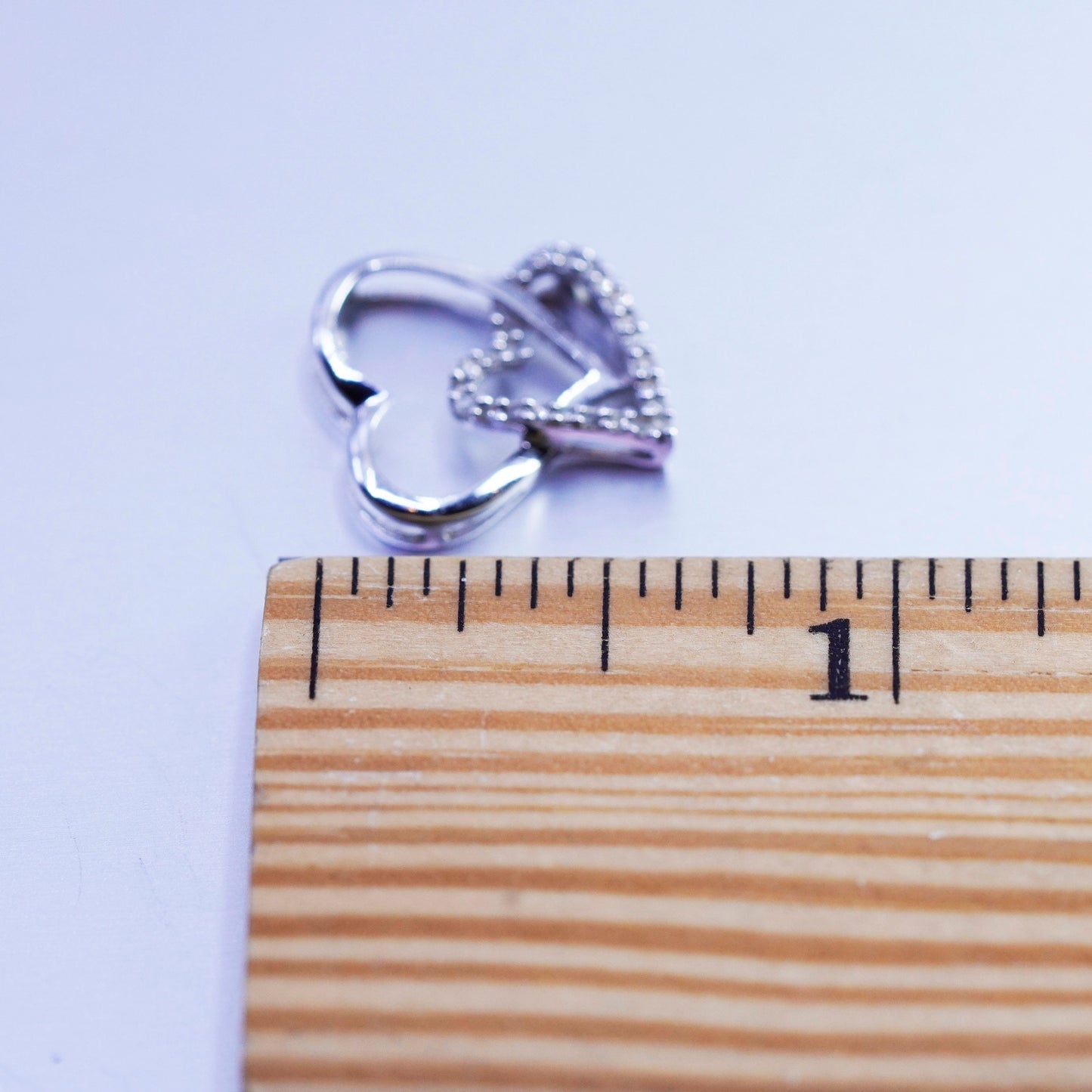 1g, Vintage 10K white gold double heart pendant with with cluster diamonds