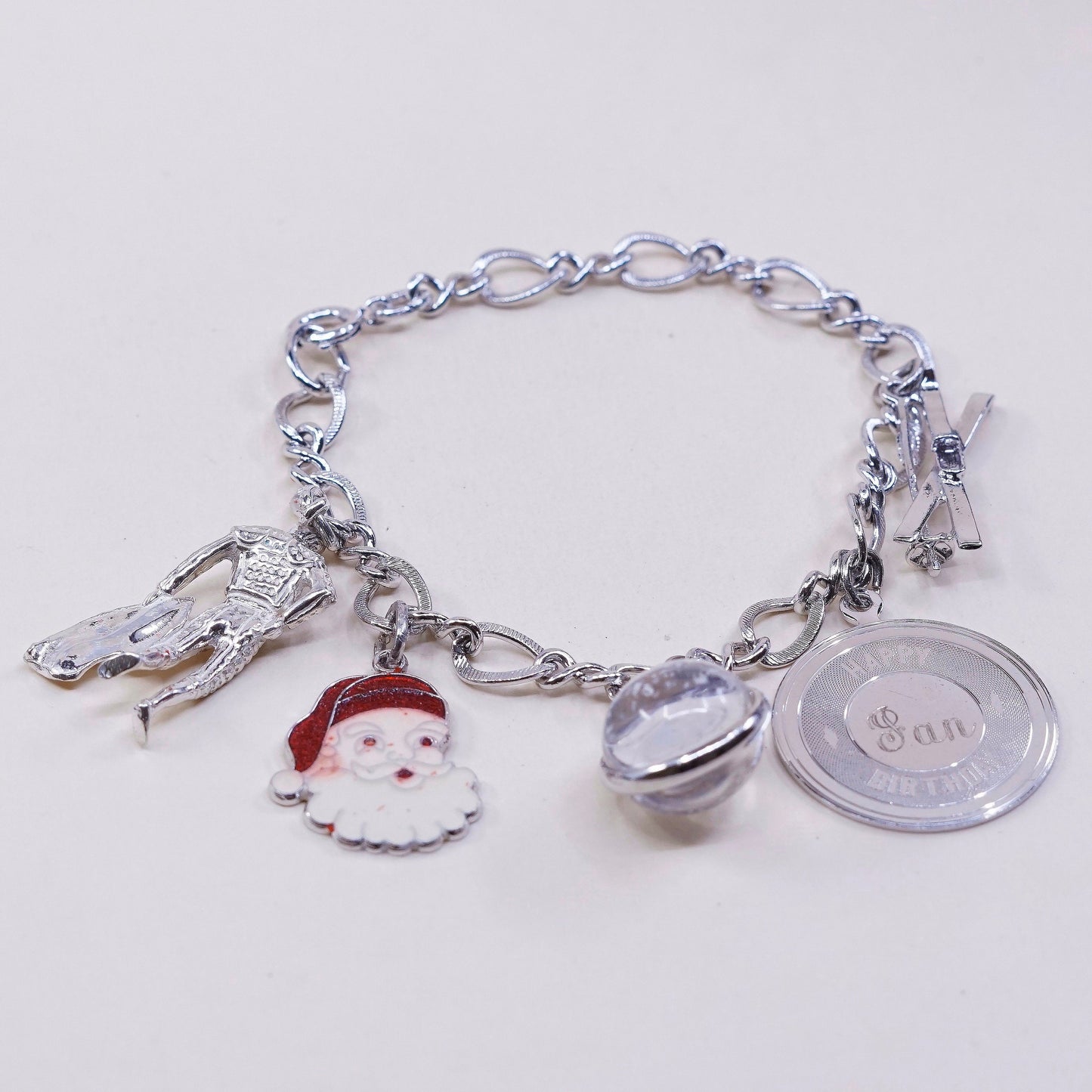 6.75”, vtg sterling 925 silver figaro, handmade bracelet w/ satan, matador, ski