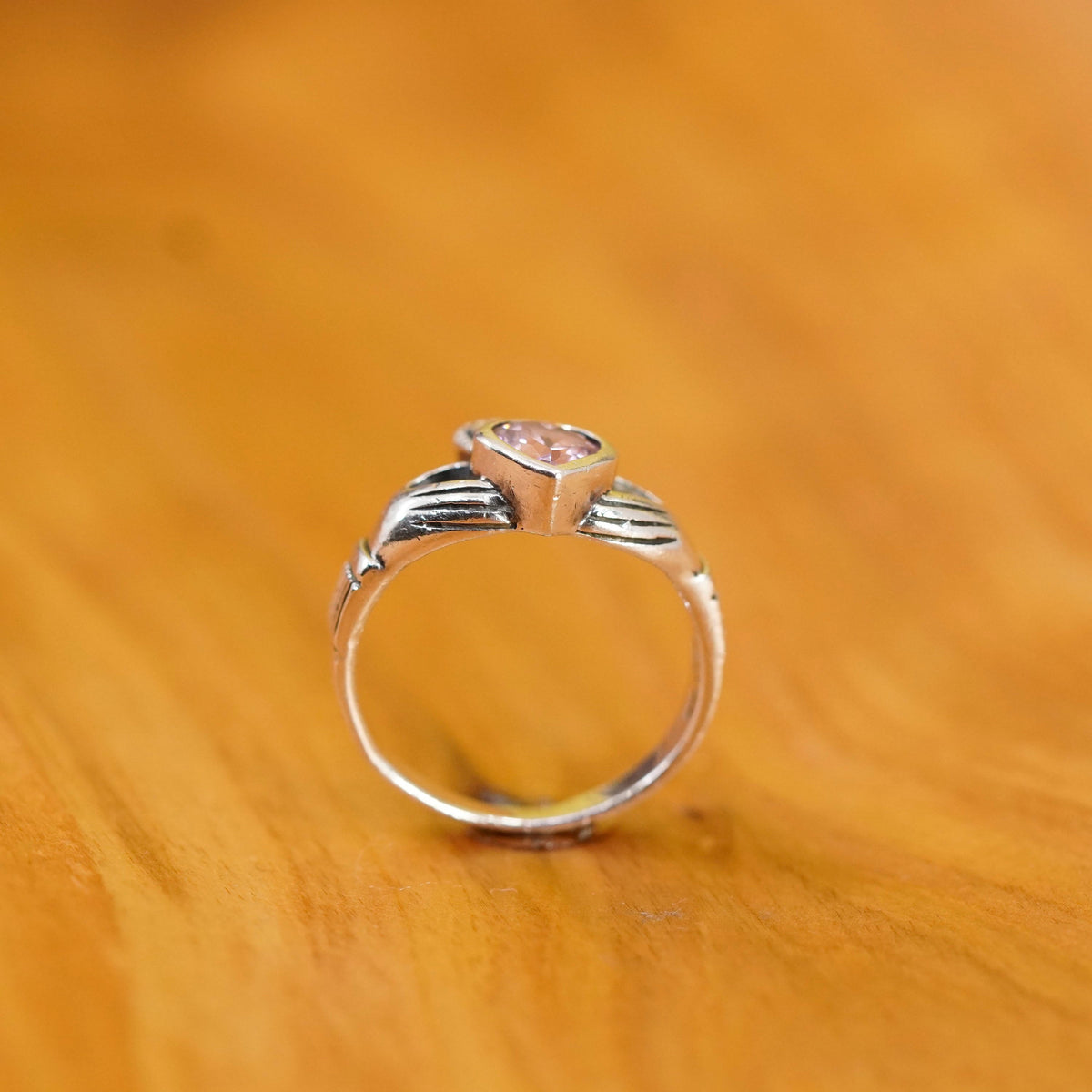 Size 7, Vintage sterling 925 silver claddagh ring, holding pink Cz heart band