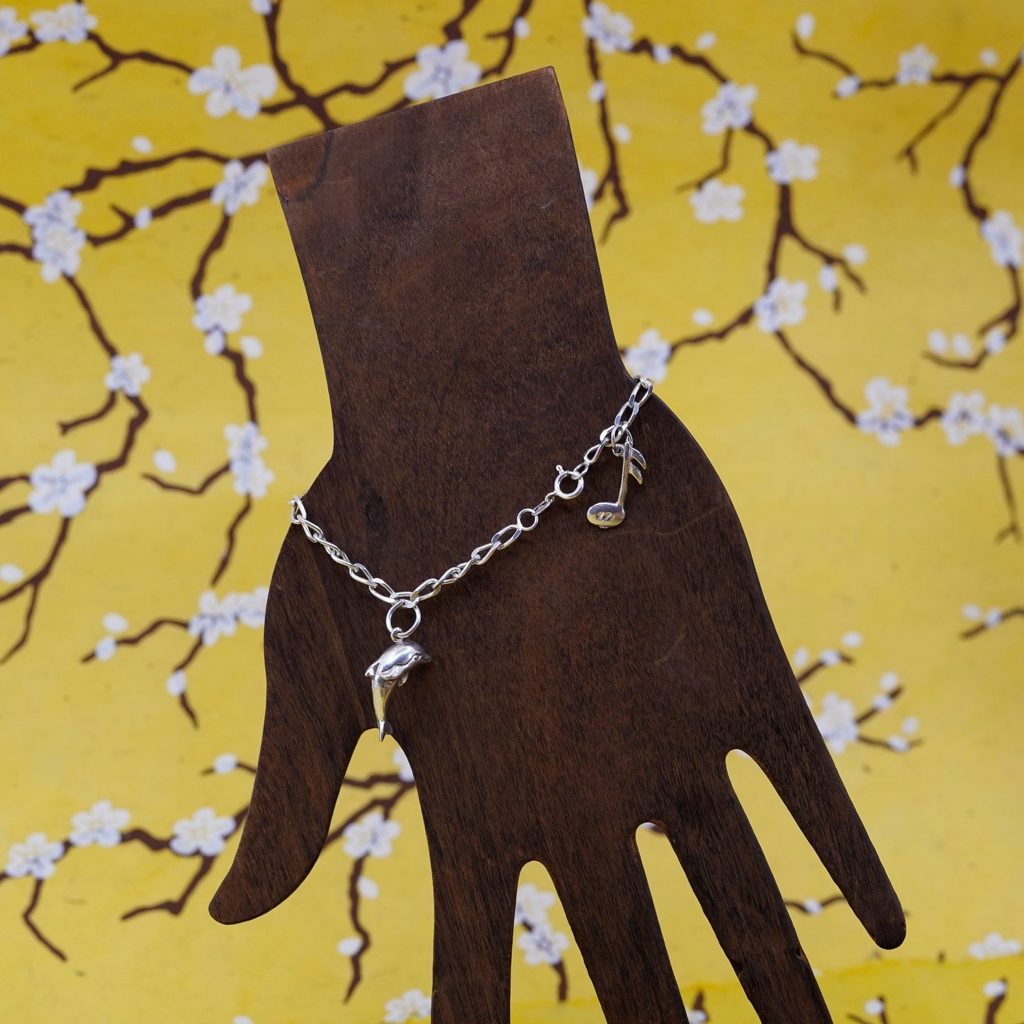 6.75”, Sterling silver bracelet, 925 curb chain with dolphin music note charms