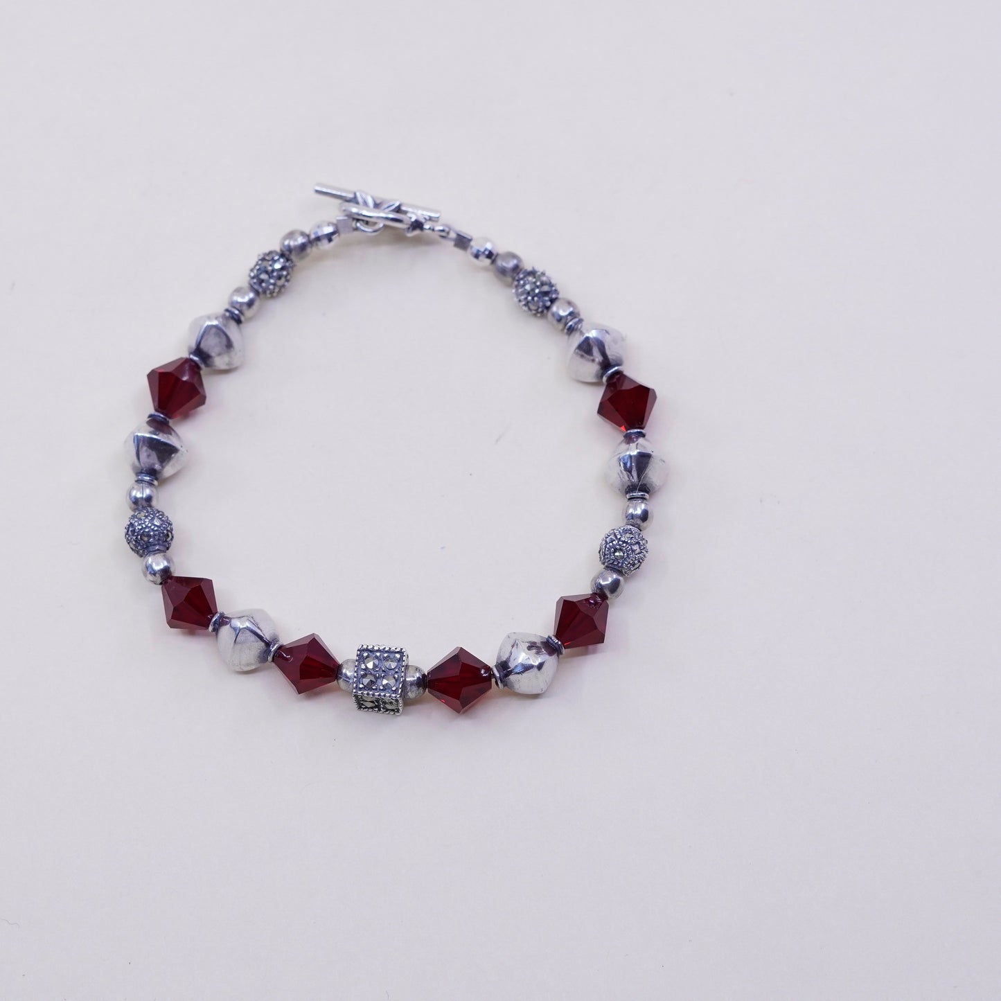 6.75”, handmade bracelet, ruby with sterling 925 silver beads N toggle closure