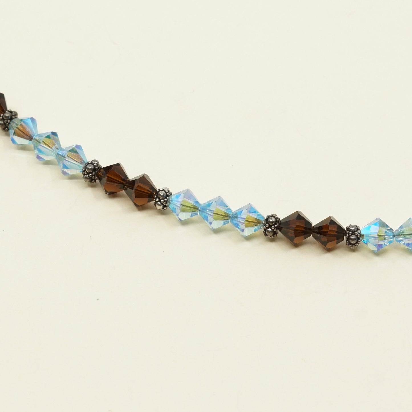 7.5”, VTG Sterling silver handmade bracelet w/ brown N blue Swarovski crystal