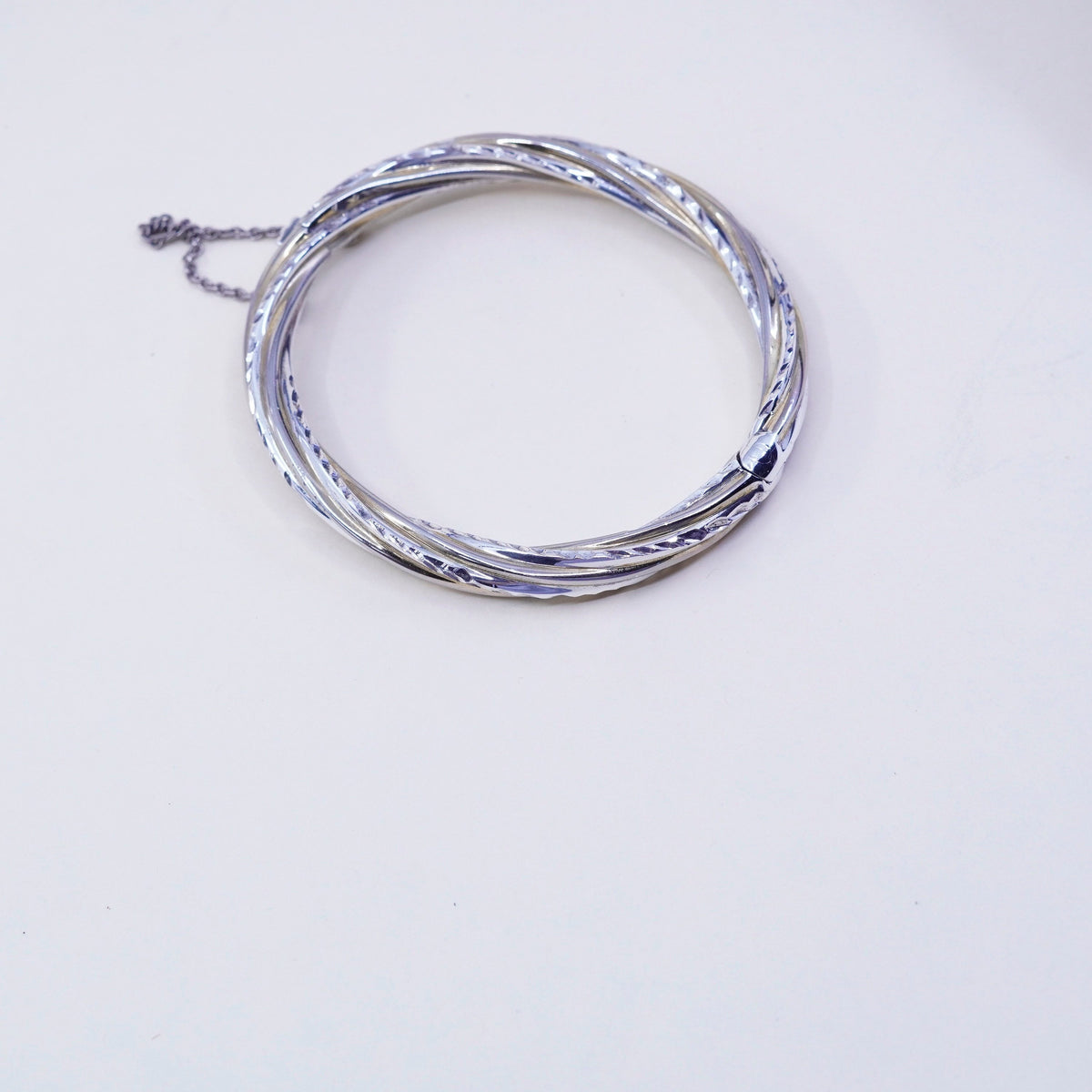 7.25”, two tone sterling silver bracelet, 925 hinged diamond twisted bangle