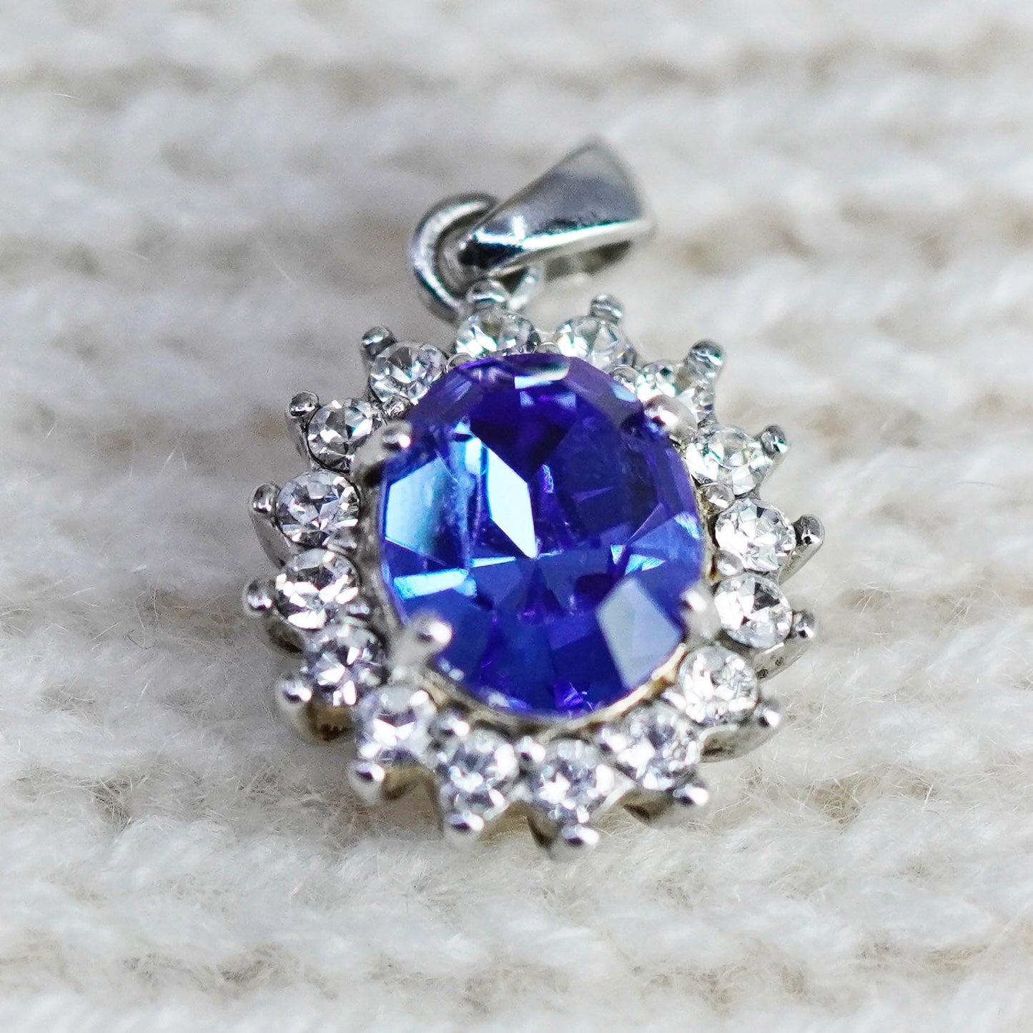 Vintage Sterling 925 silver pendant with oval blue topaz and cz around