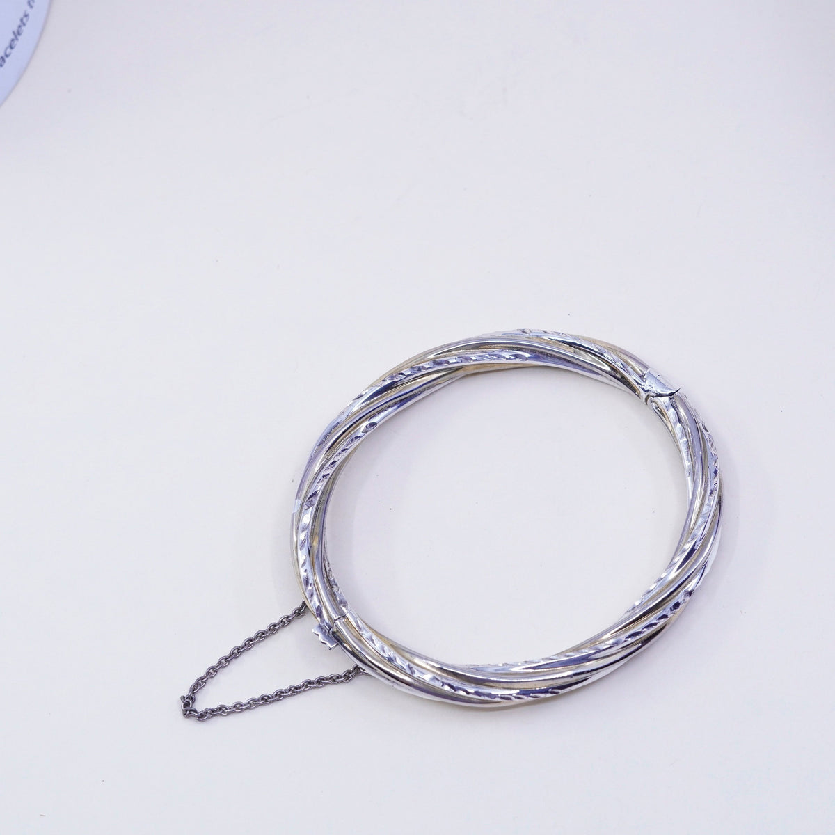 7.25”, two tone sterling silver bracelet, 925 hinged diamond twisted bangle