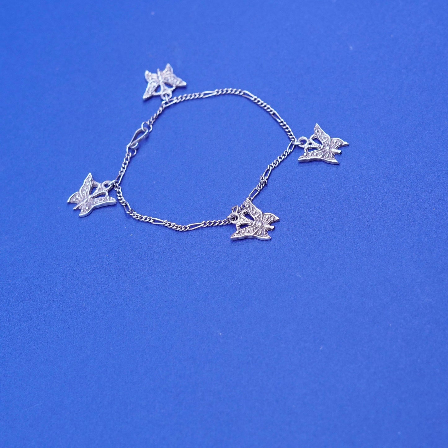 6.5”, vintage Sterling 925 silver figaro bracelet, chain with butterfly charms