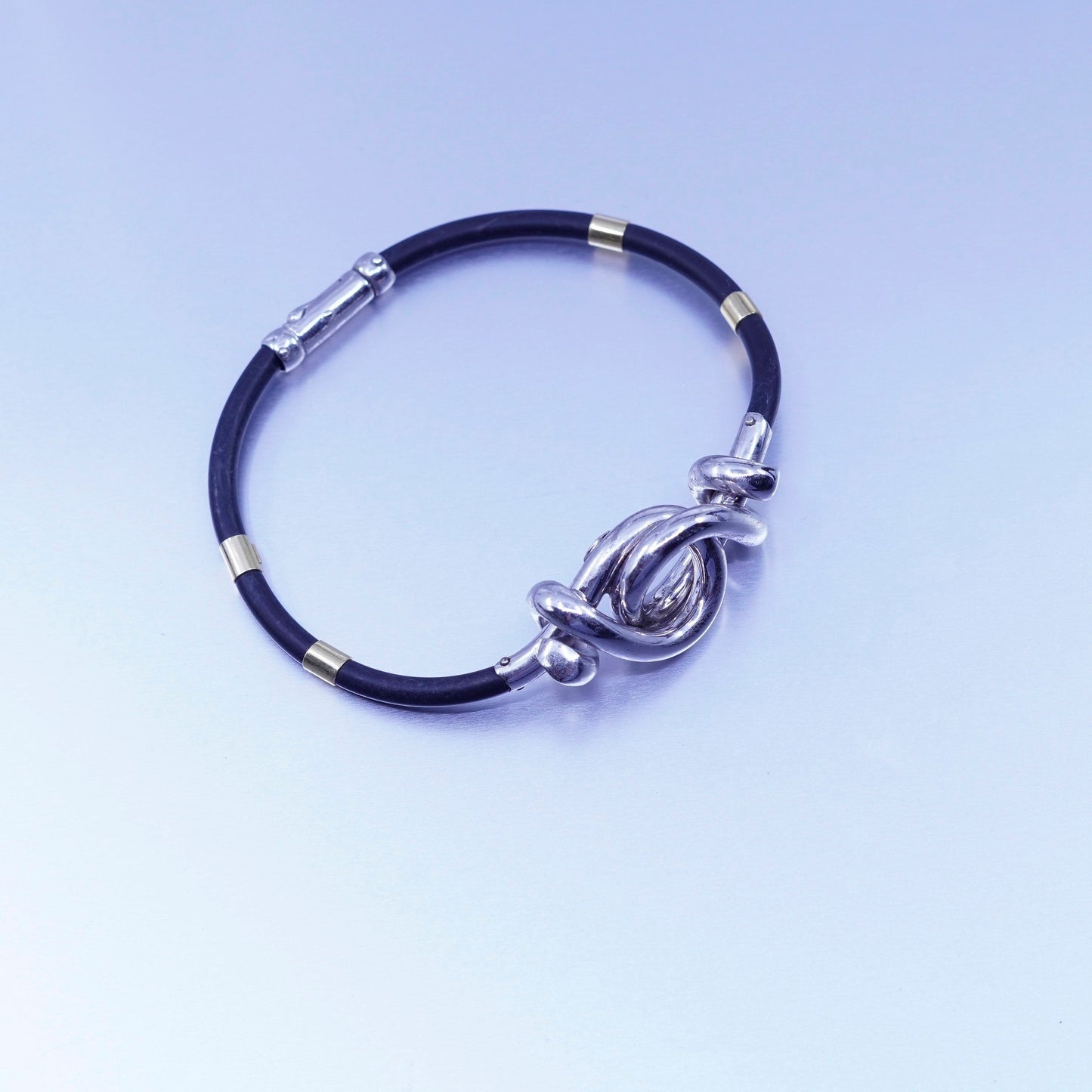 6.75”, sterling 925 silver knot bracelet with 14K gold tube black rubber chain