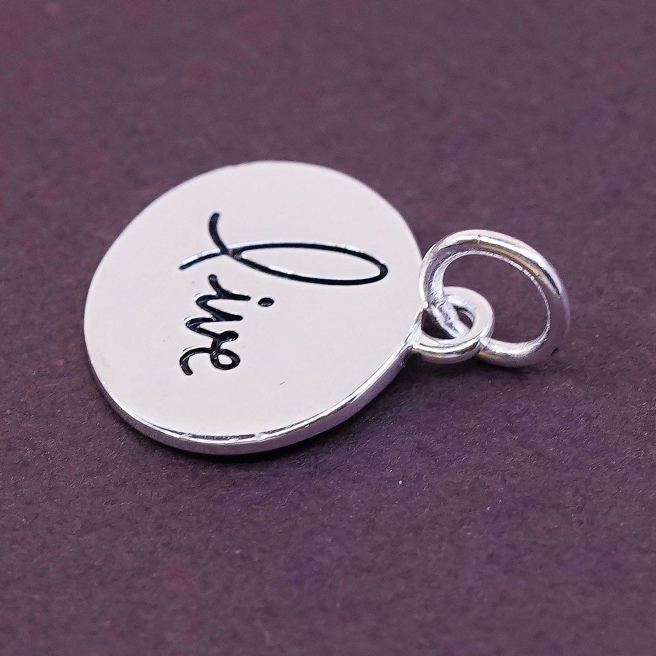 vtg Sterling silver handmade charm, 925 tag pendant embossed “live”